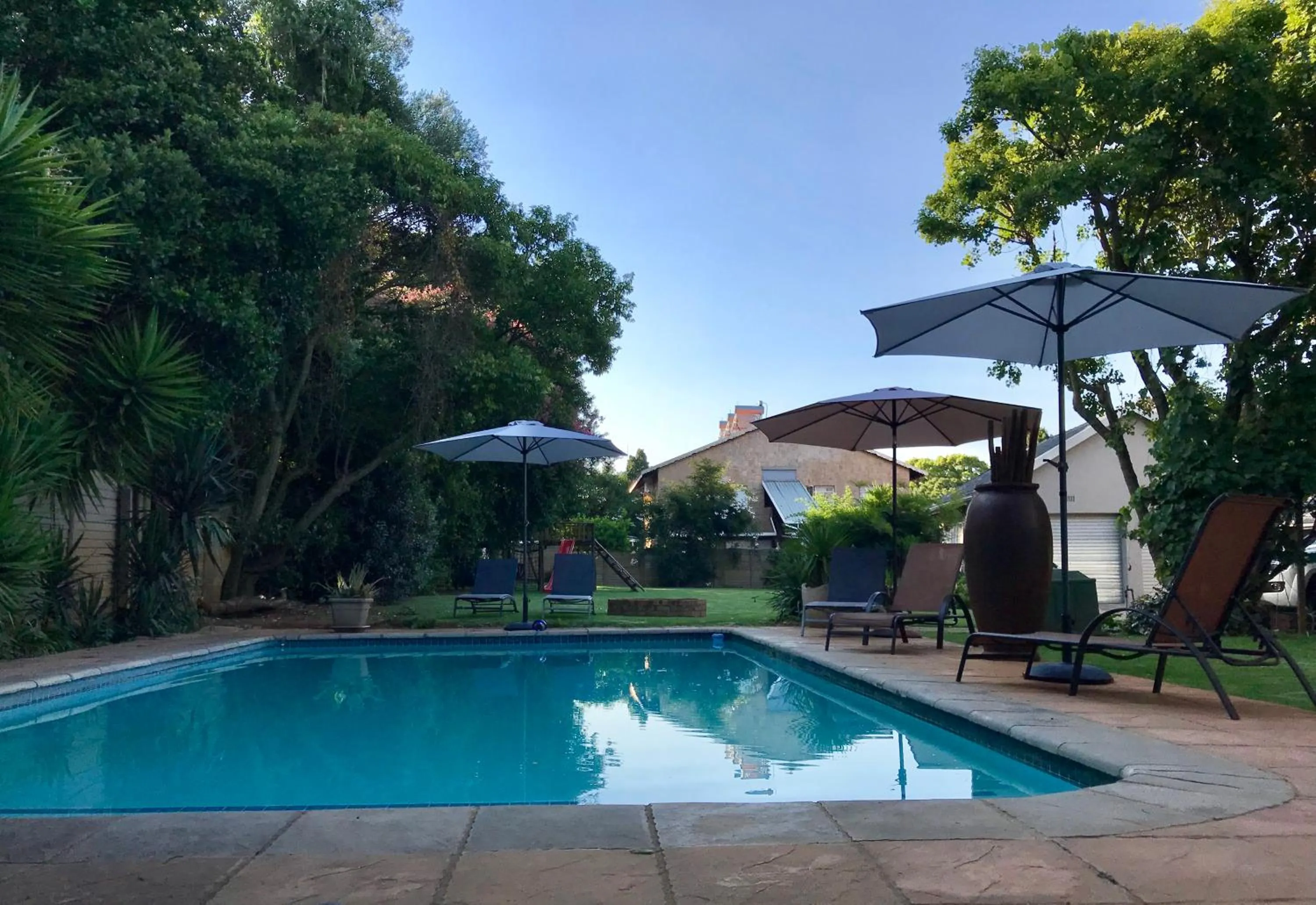 Swimming pool in Aerotropolis Guest Lodge
