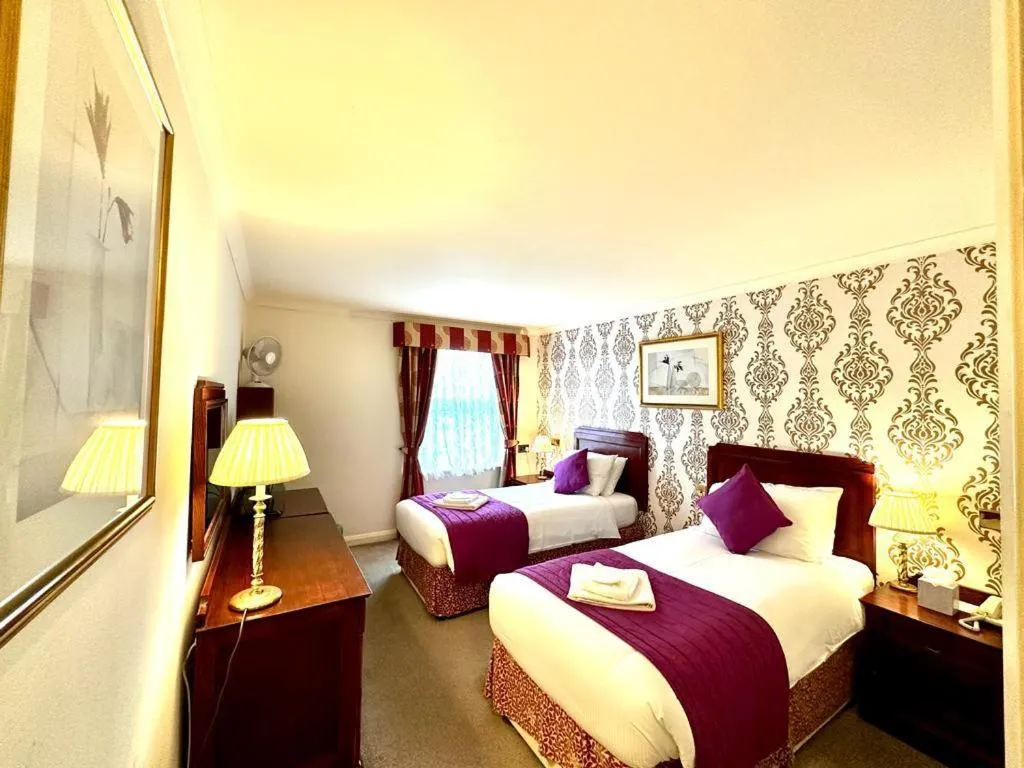 Bed in La Trelade Hotel