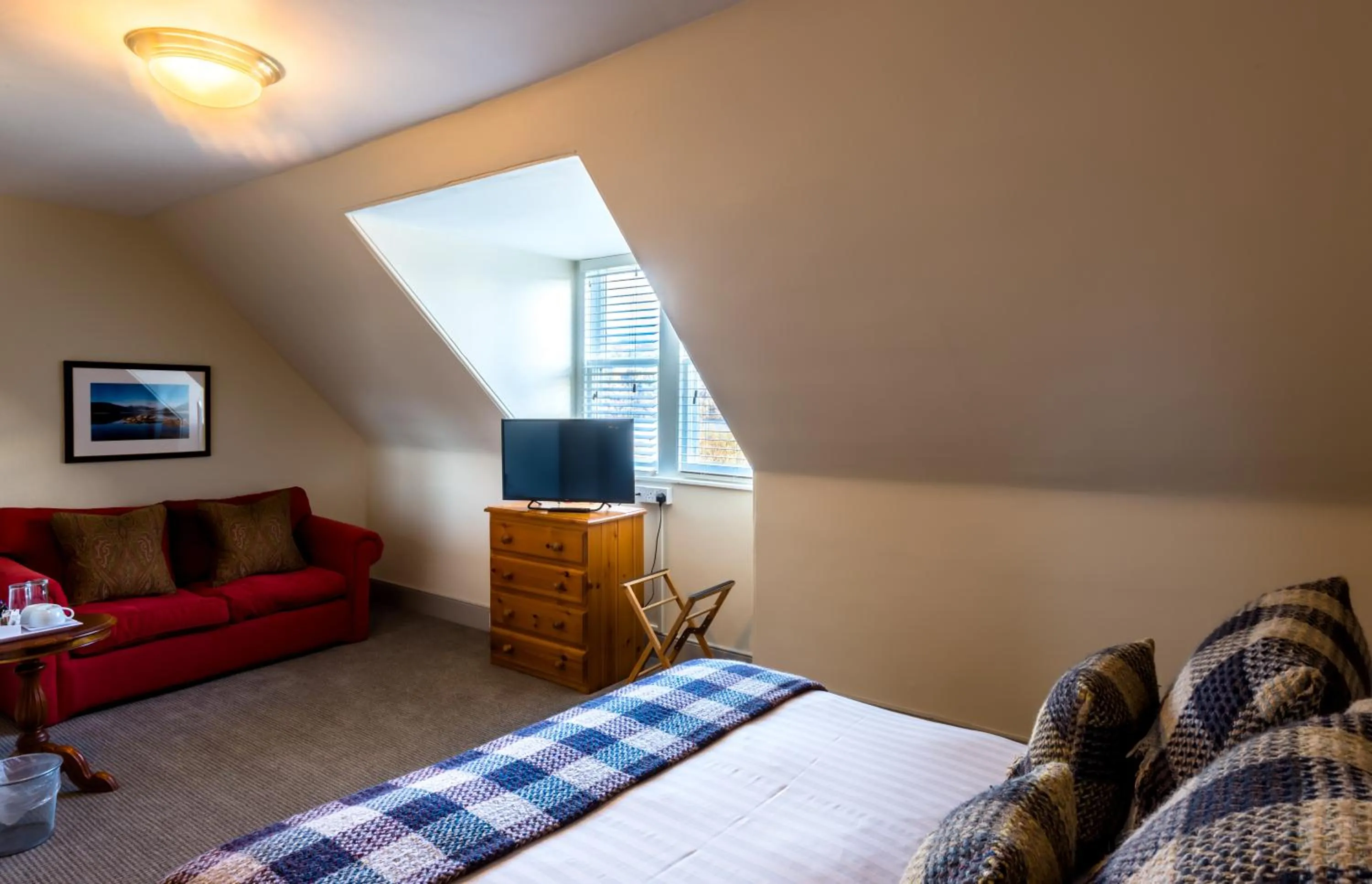 Photo of the whole room, Bed in Inch Hotel