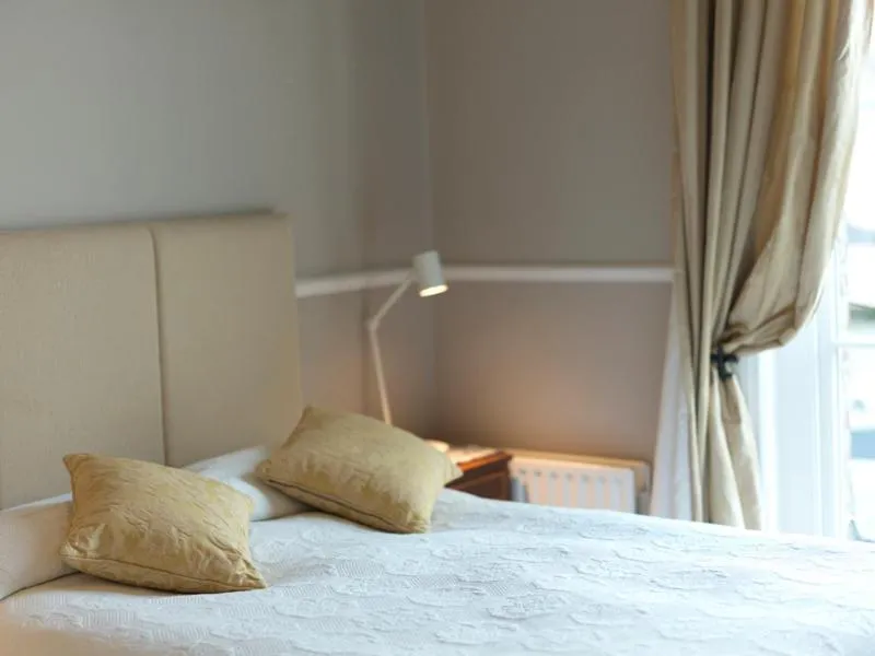 Bed in Harveys Guest House