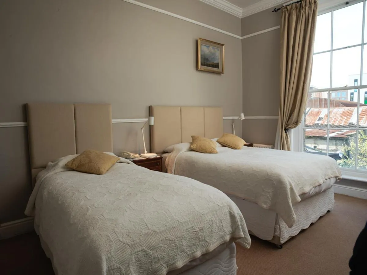 Bed in Harveys Guest House