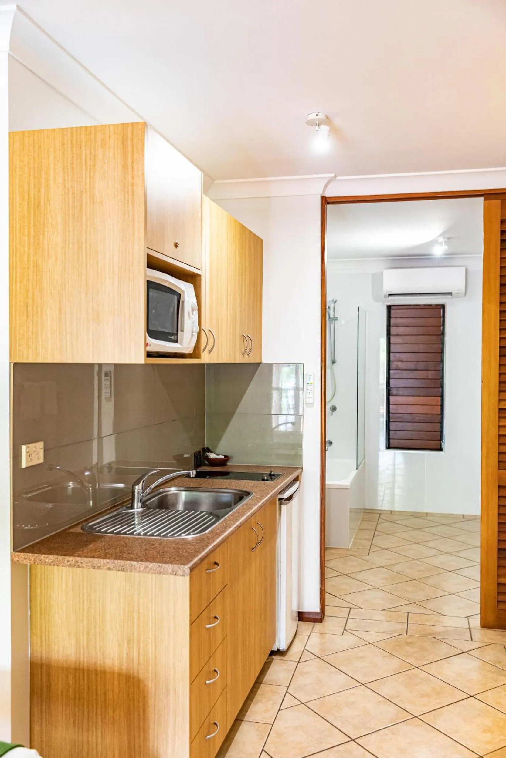 Kitchen or kitchenette in Hibiscus Resort & Spa - Official Onsite Reception & Check In