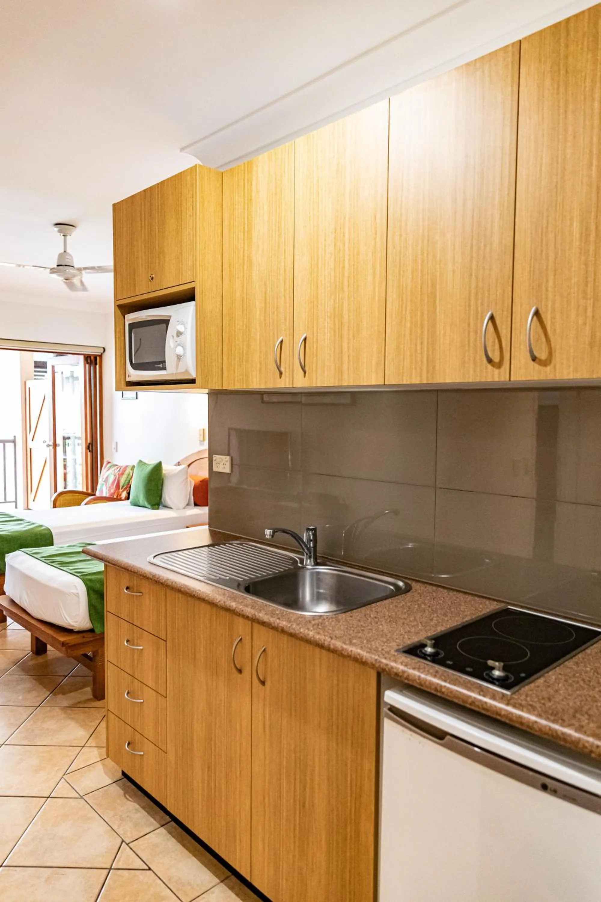 Kitchen or kitchenette in Hibiscus Resort & Spa - Official Onsite Reception & Check In