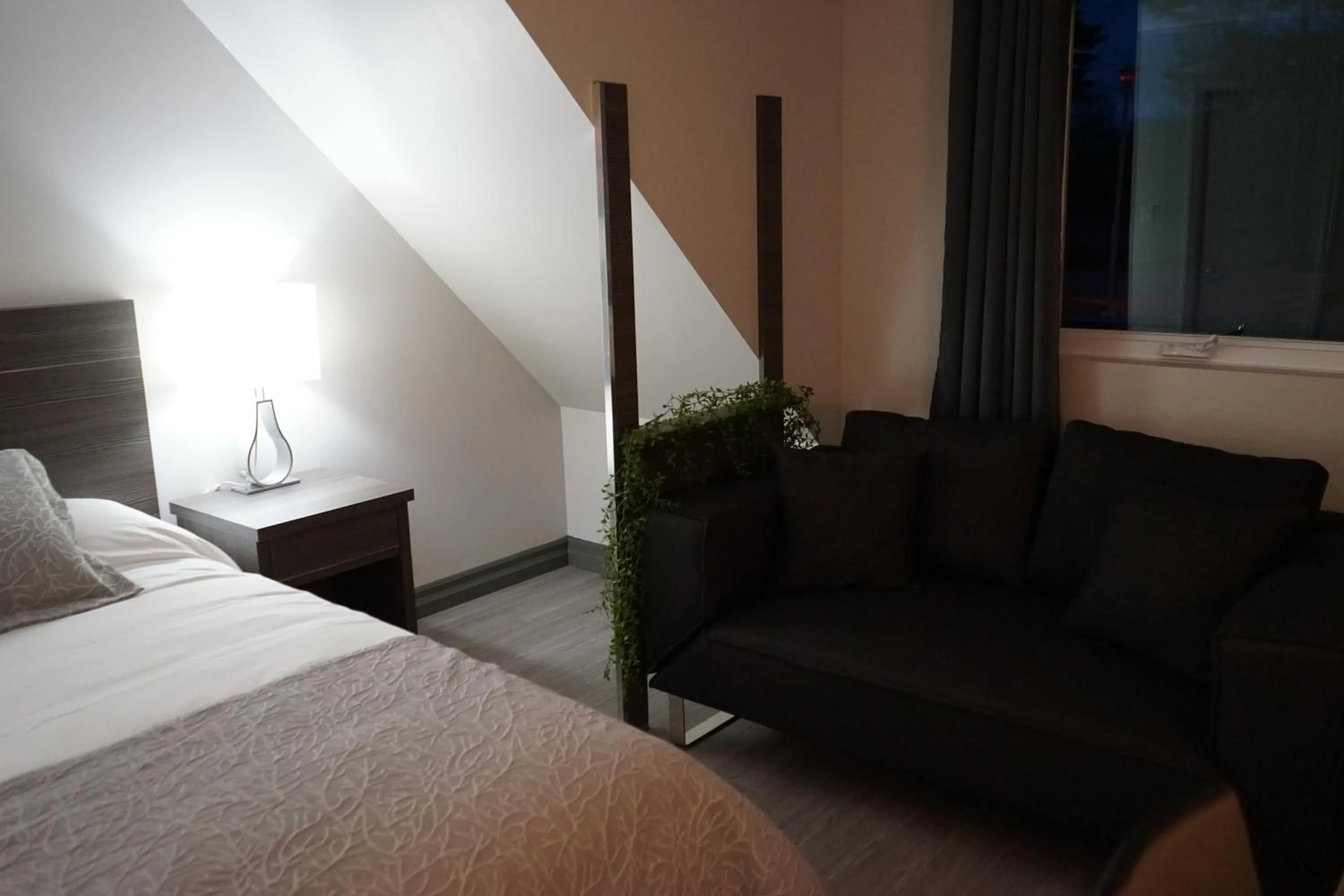 Seating area, Bed in Amber Hotel