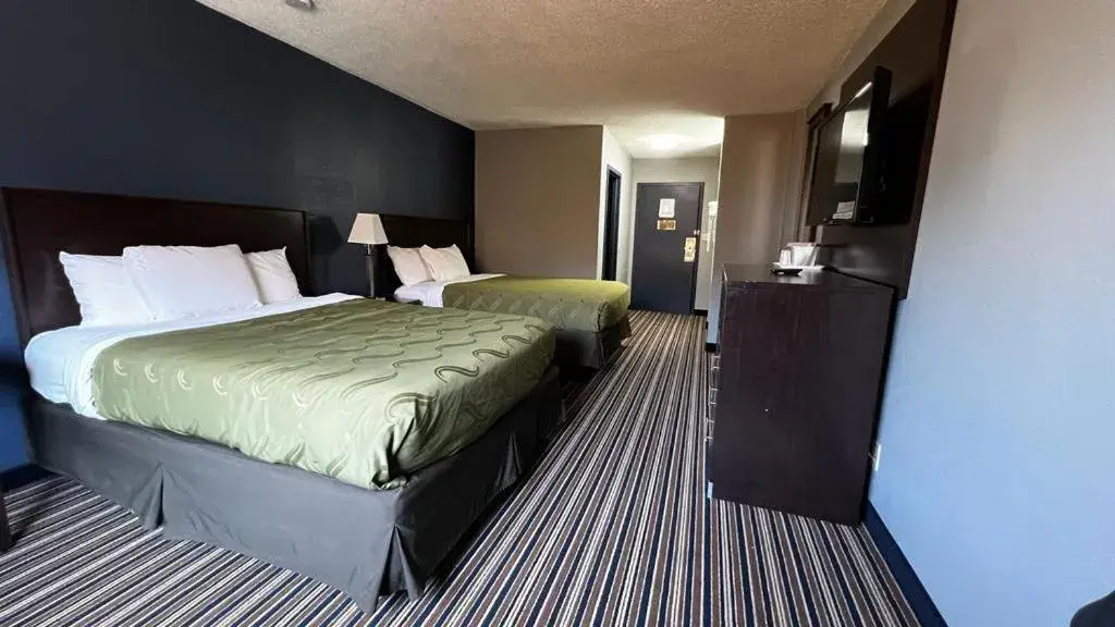 Bed in Colby Inn and Suites Bed in Colby Inn and Suites