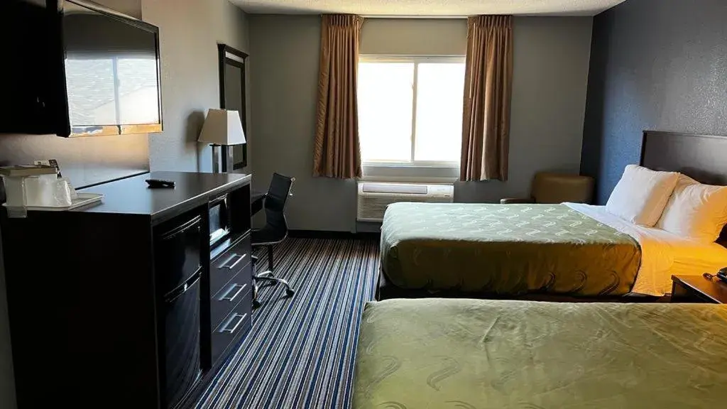 Bed in Colby Inn and Suites Bed in Colby Inn and Suites
