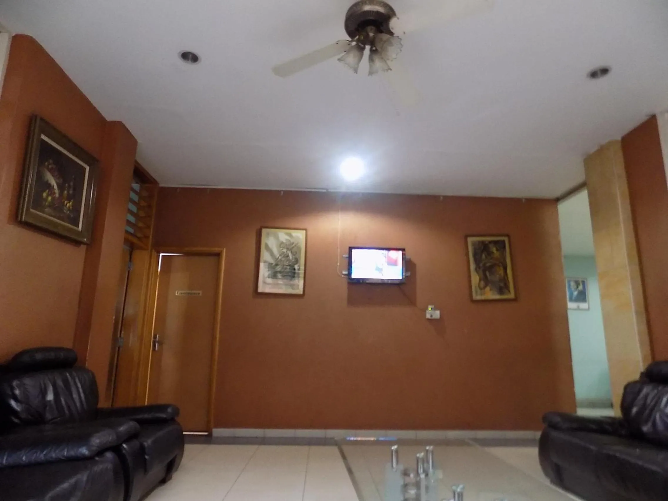 Communal lounge/ TV room in Aponye Hotel Kampala