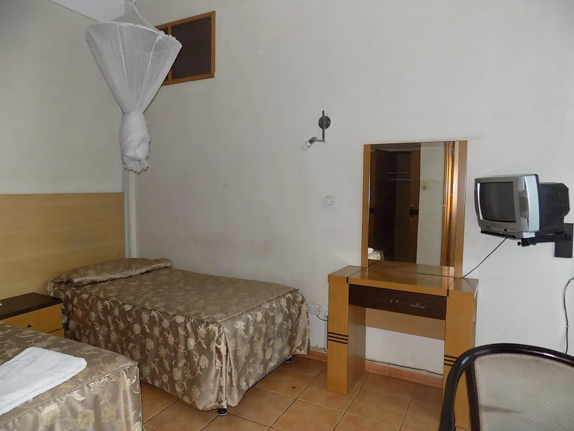 Bed in Aponye Hotel Kampala