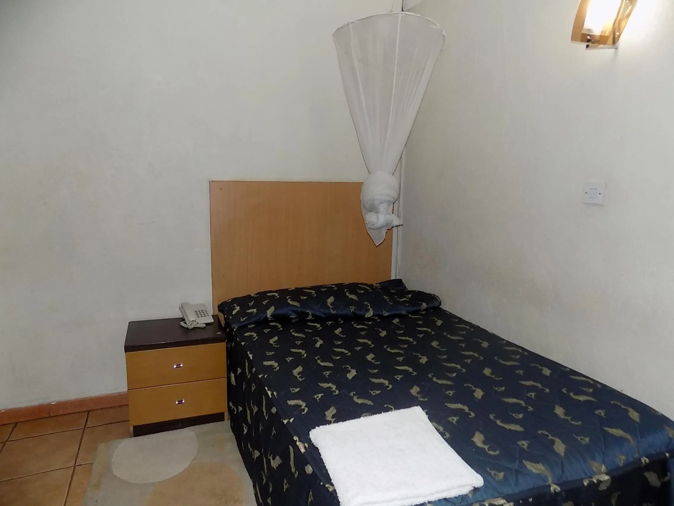 Bed in Aponye Hotel Kampala