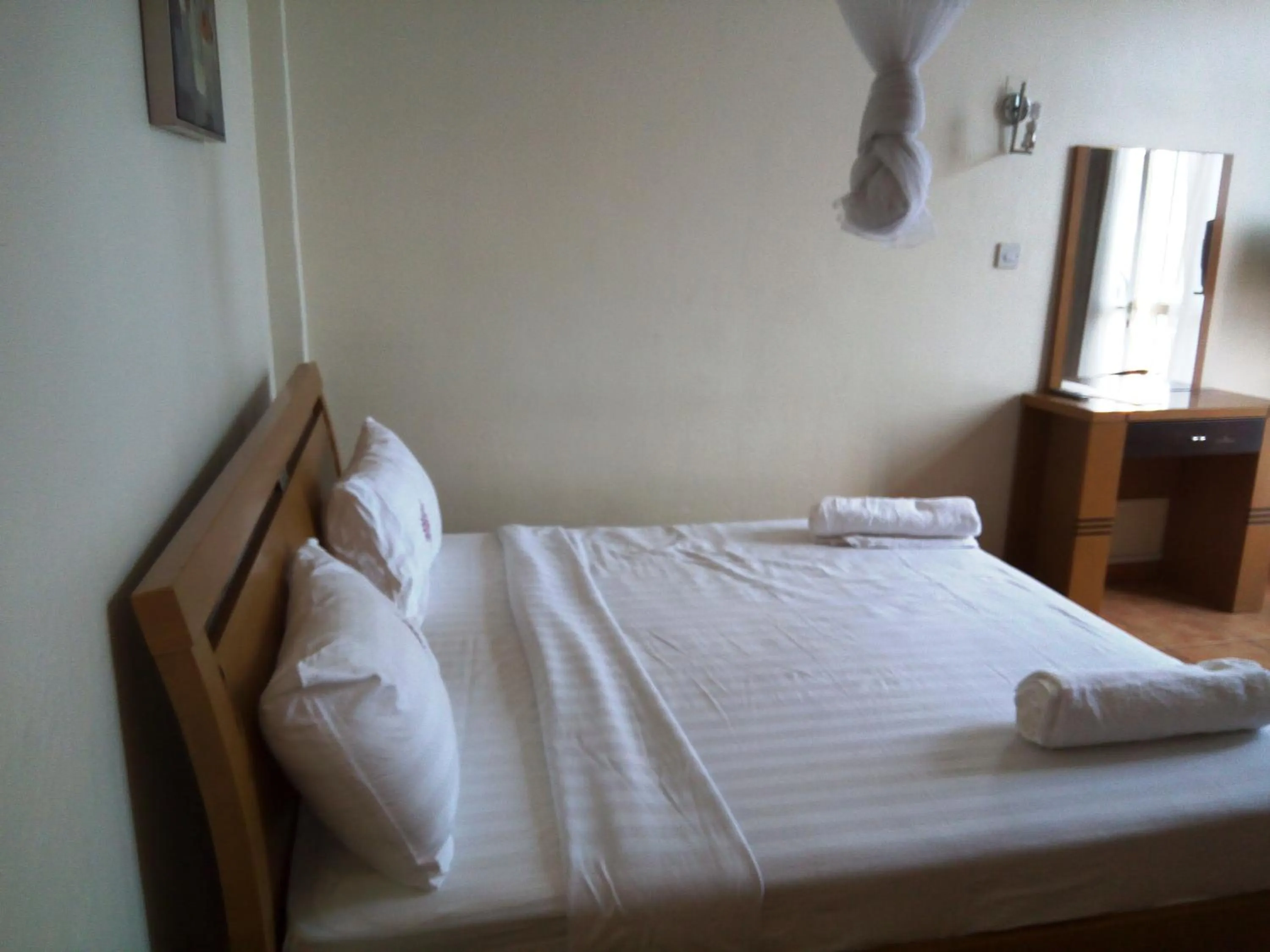 Bed in Aponye Hotel Kampala