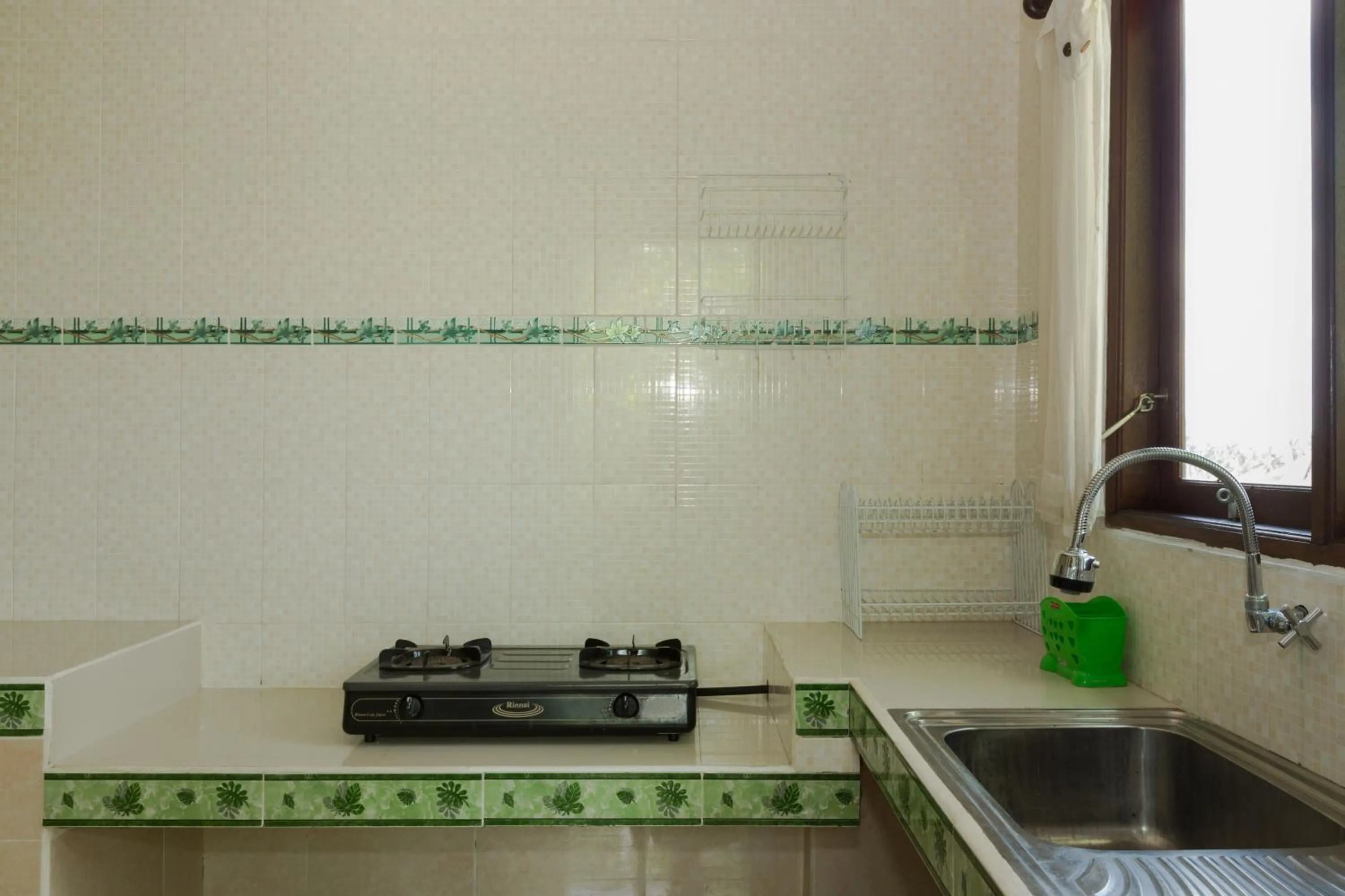 Kitchen or kitchenette in Cahaya Ubud Villa