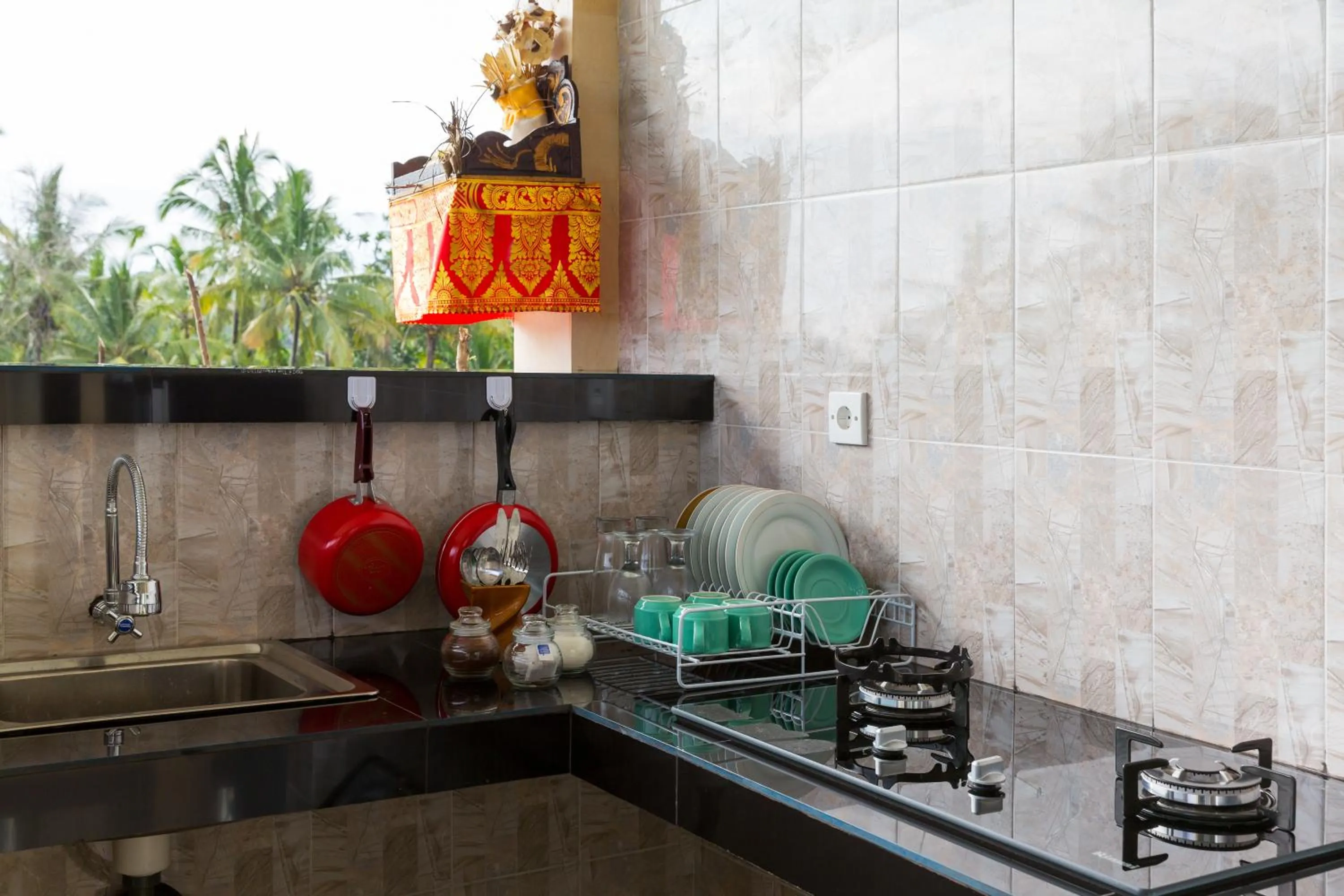 Kitchen or kitchenette in Cahaya Ubud Villa