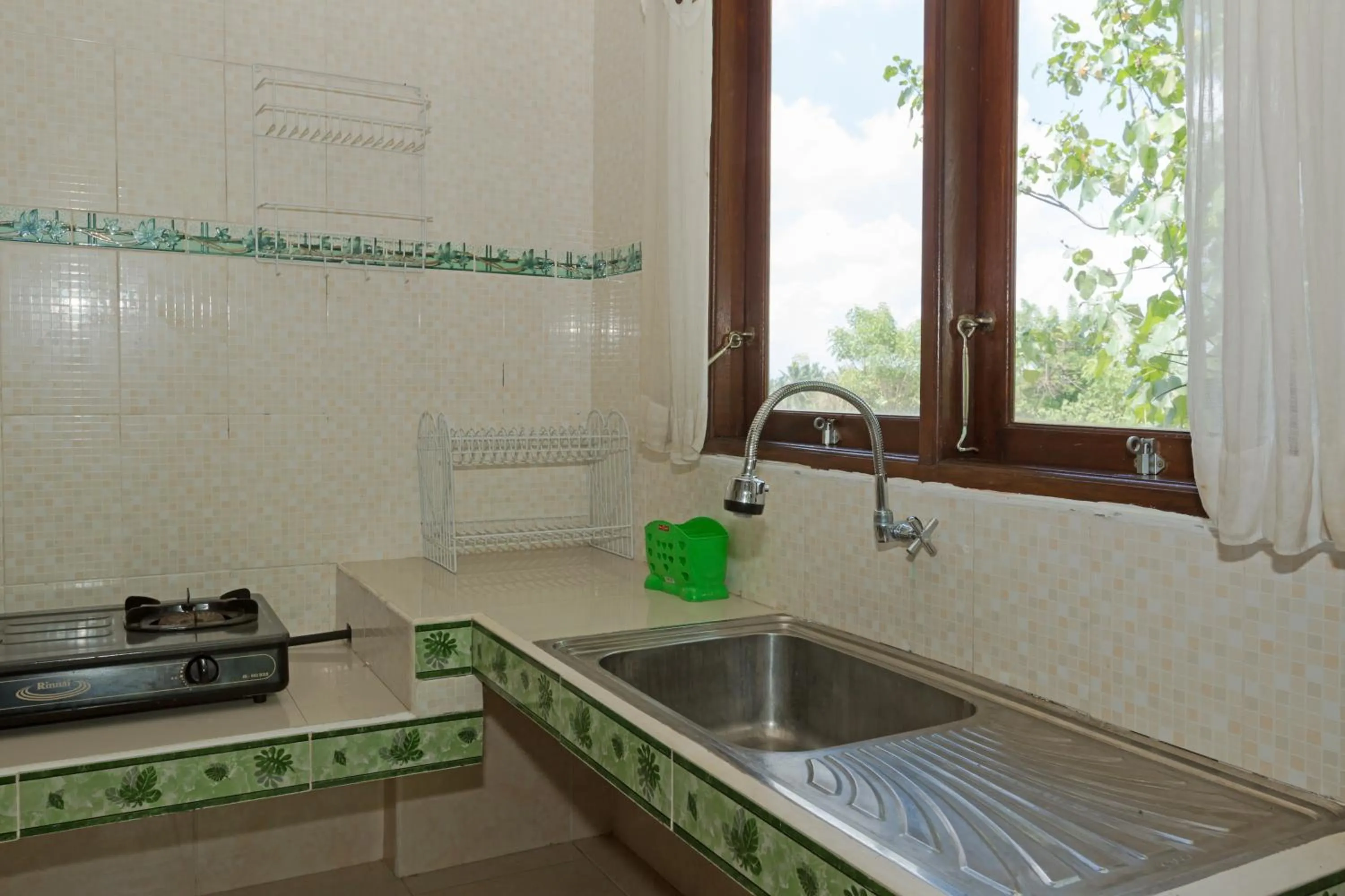 Kitchen or kitchenette in Cahaya Ubud Villa