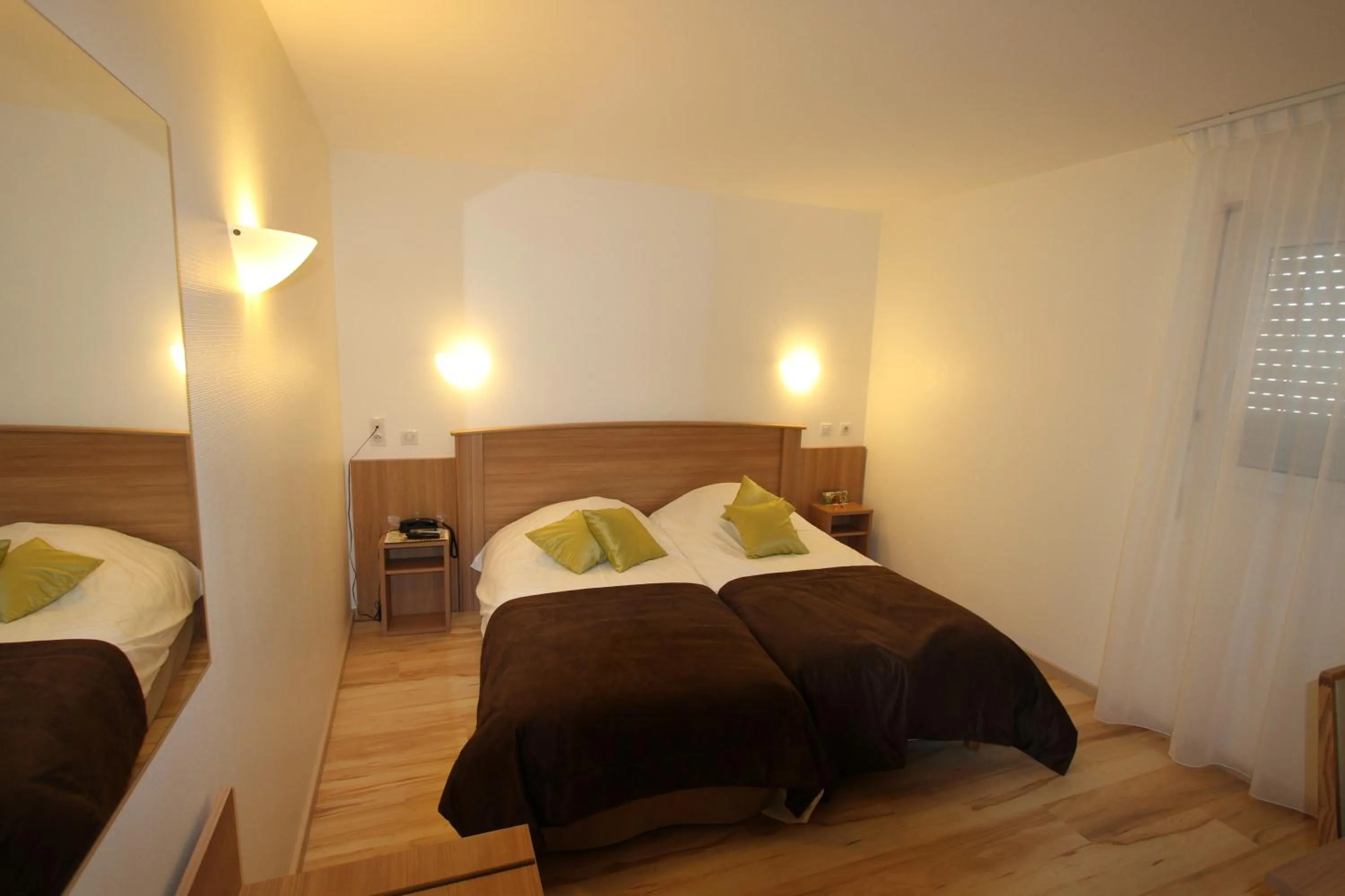 Bed in Logis Hotel Restaurant Le Grand Turc