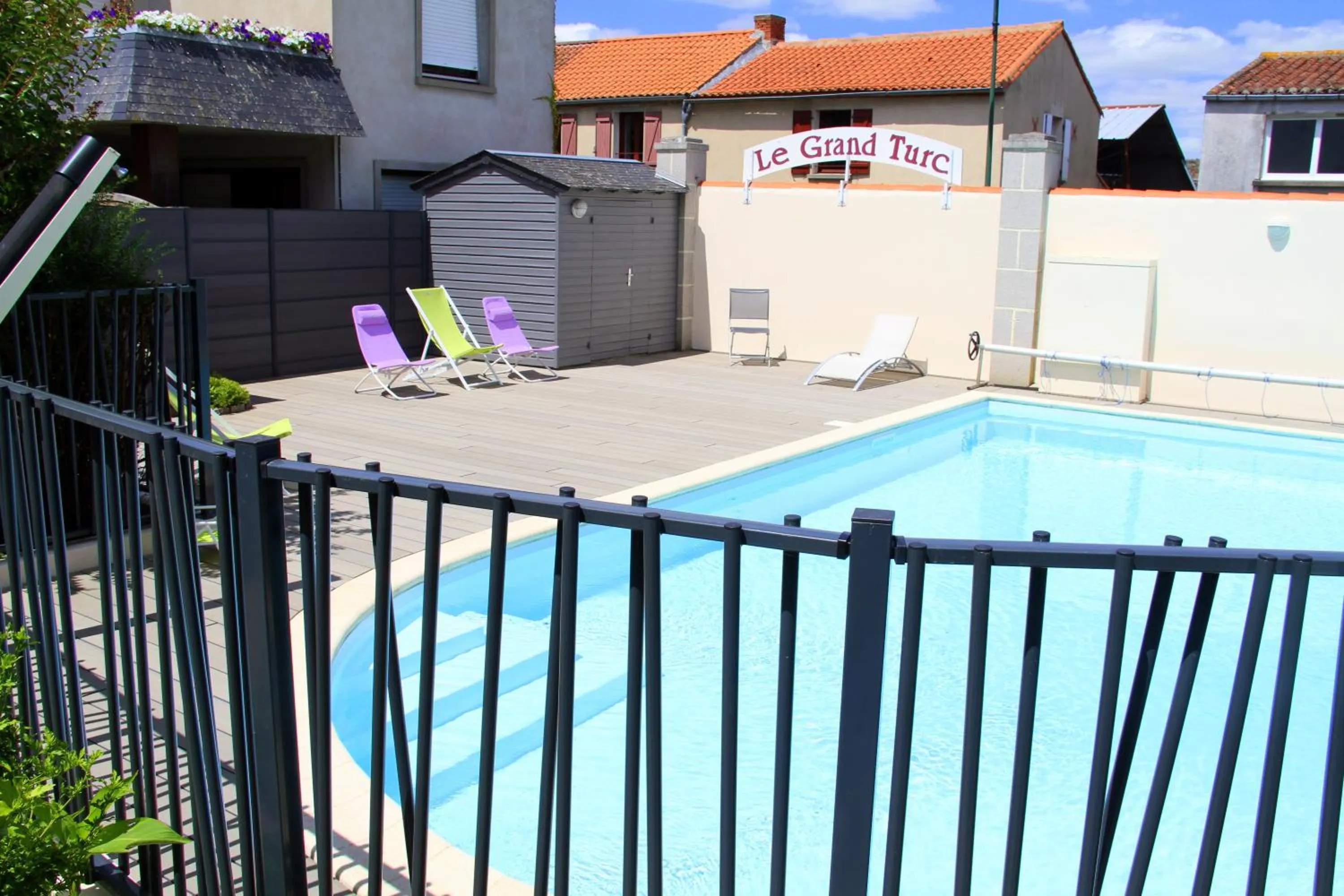 Garden in Logis Hotel Restaurant Le Grand Turc