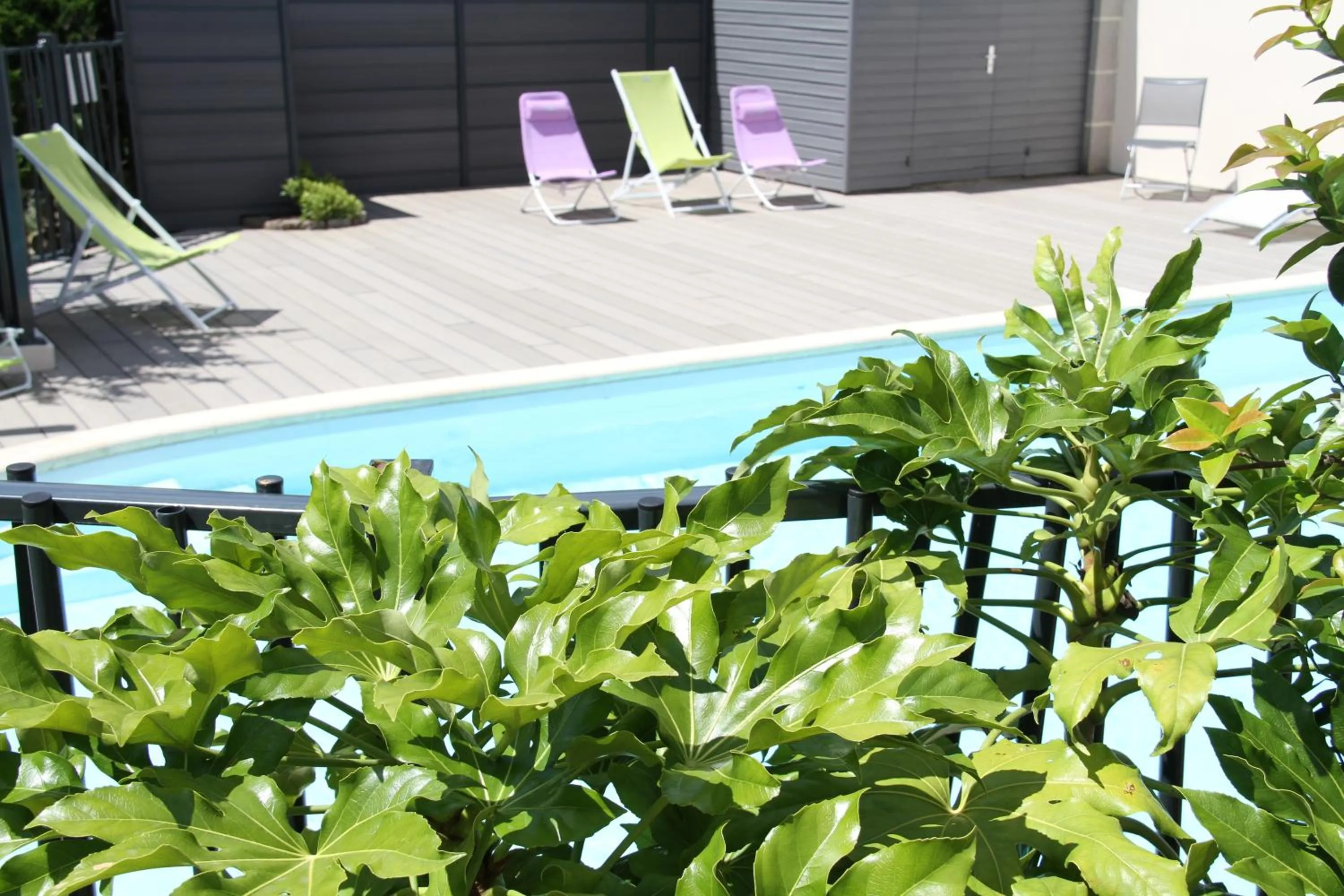 Swimming pool in Logis Hotel Restaurant Le Grand Turc