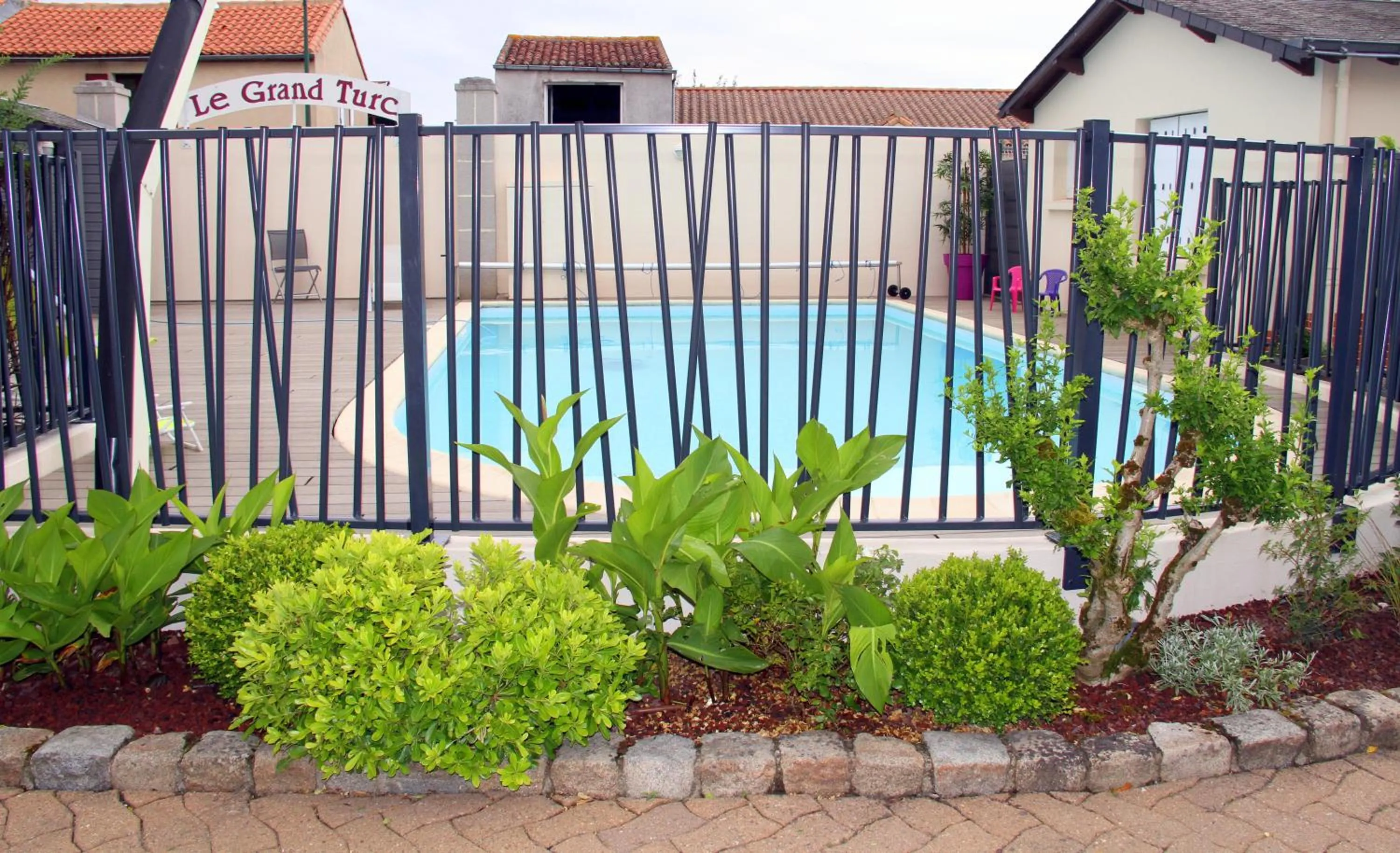 Swimming pool in Logis Hotel Restaurant Le Grand Turc