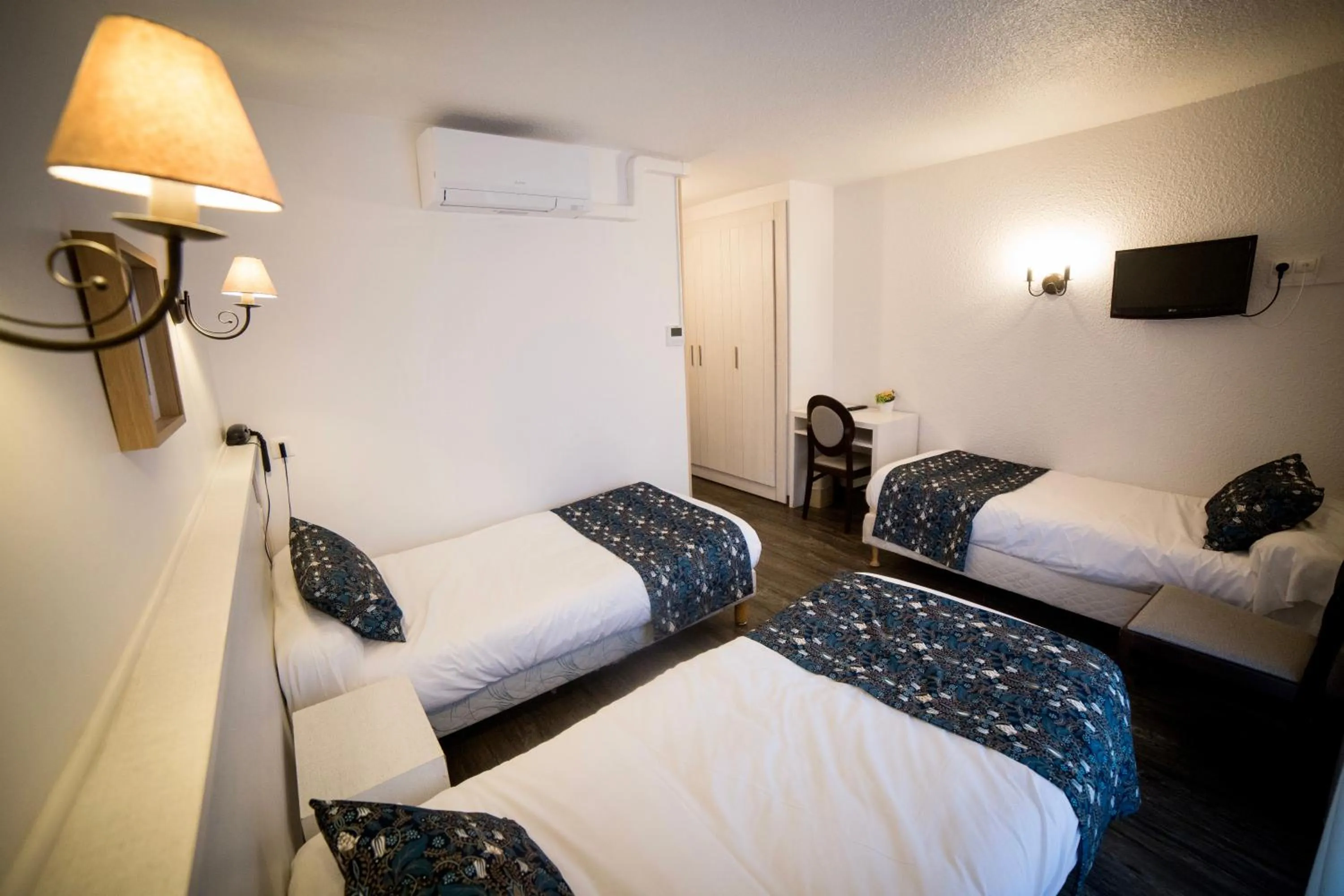 Bed in Le Catinat Fleuri