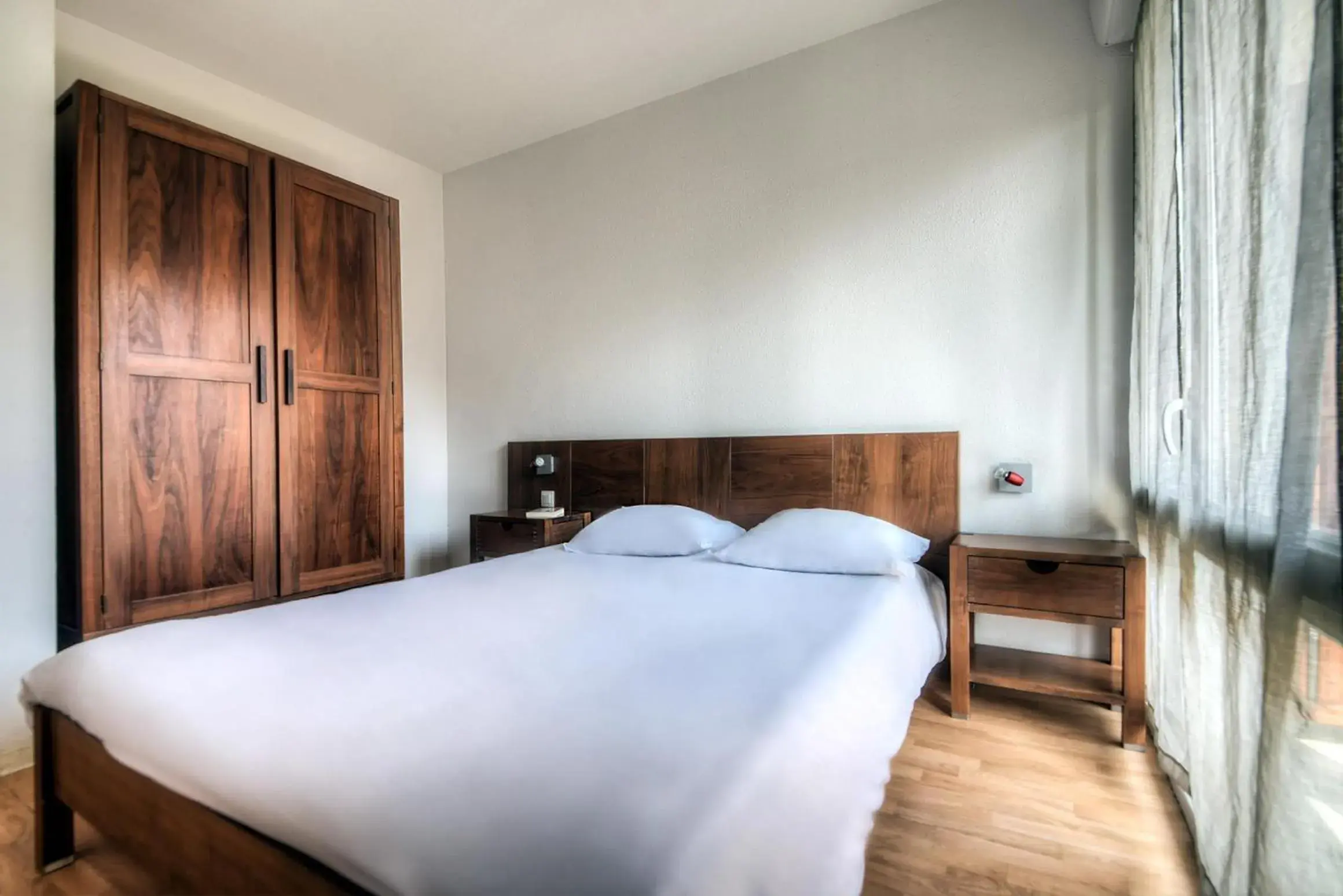 Photo of the whole room, Bed in Comfort Aparthotel Lourdes L'Acacia Photo of the whole room, Bed in Comfort Aparthotel Lourdes L'Acacia