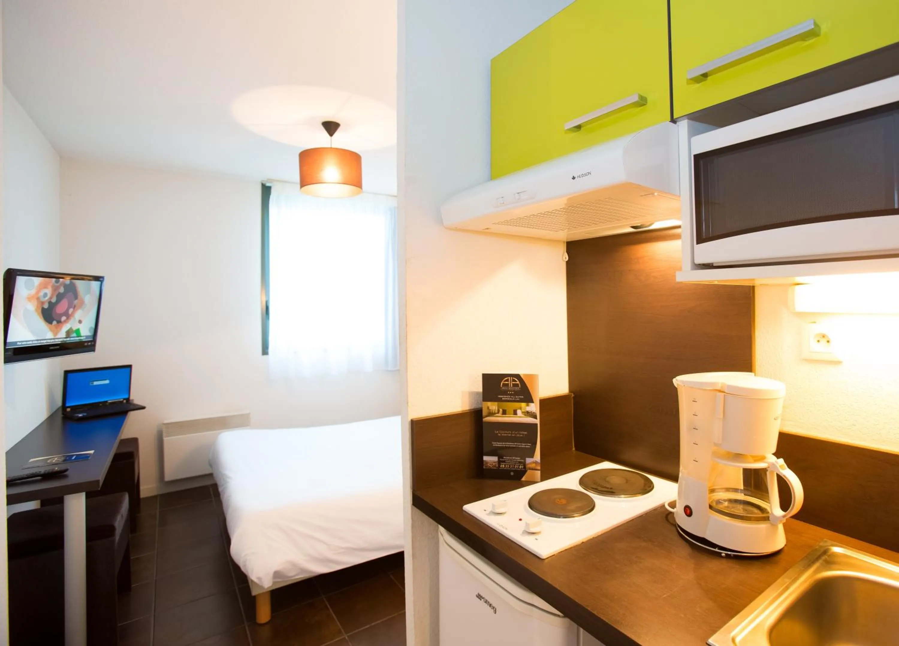 Kitchen or kitchenette in All Suites Appart Hôtel - Bordeaux Lac