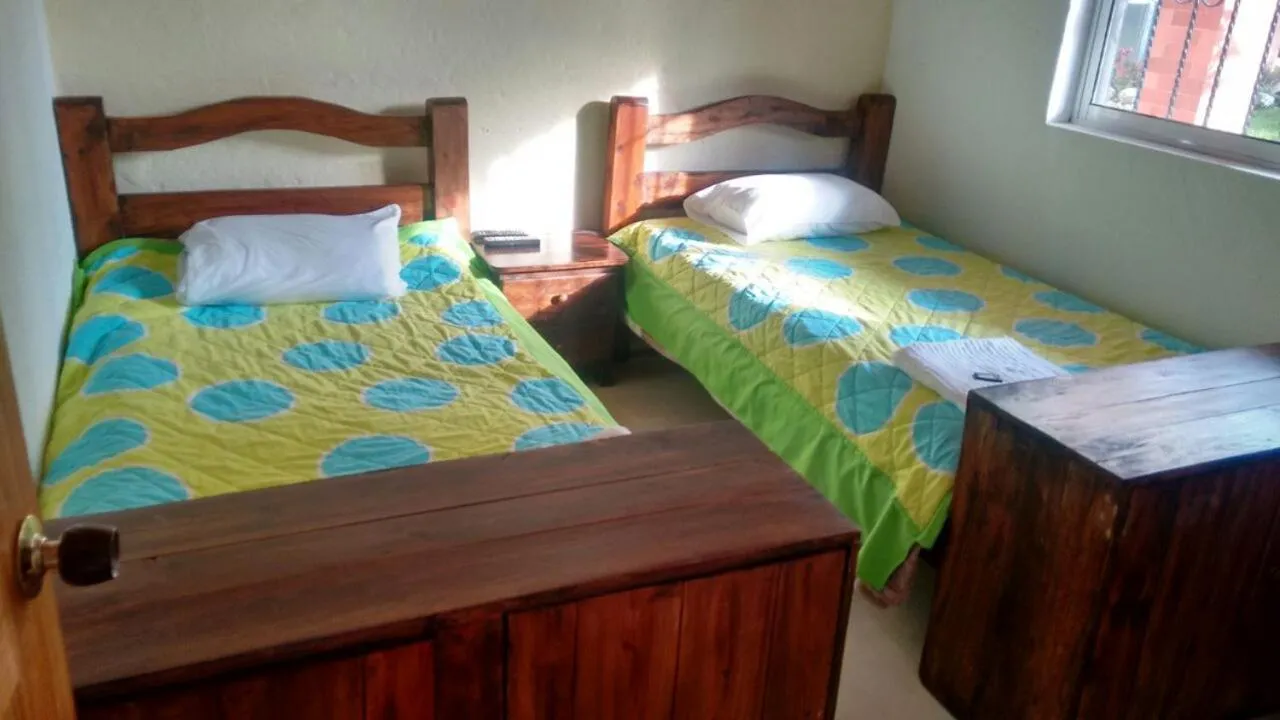 Photo of the whole room, Bed in Finca Hotel La Ponderosa