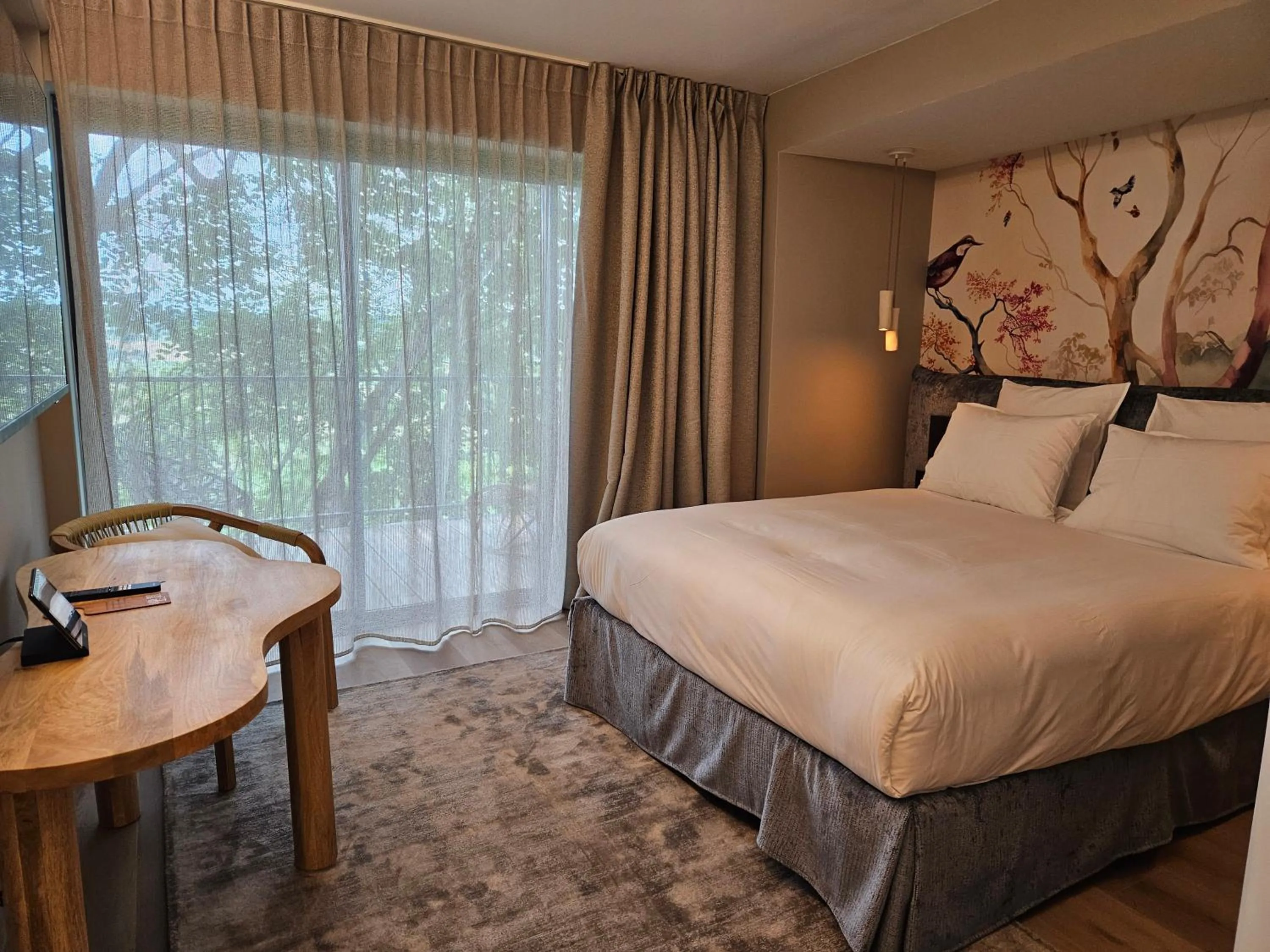 Bed in Le Belvédère Hotel et Bien être