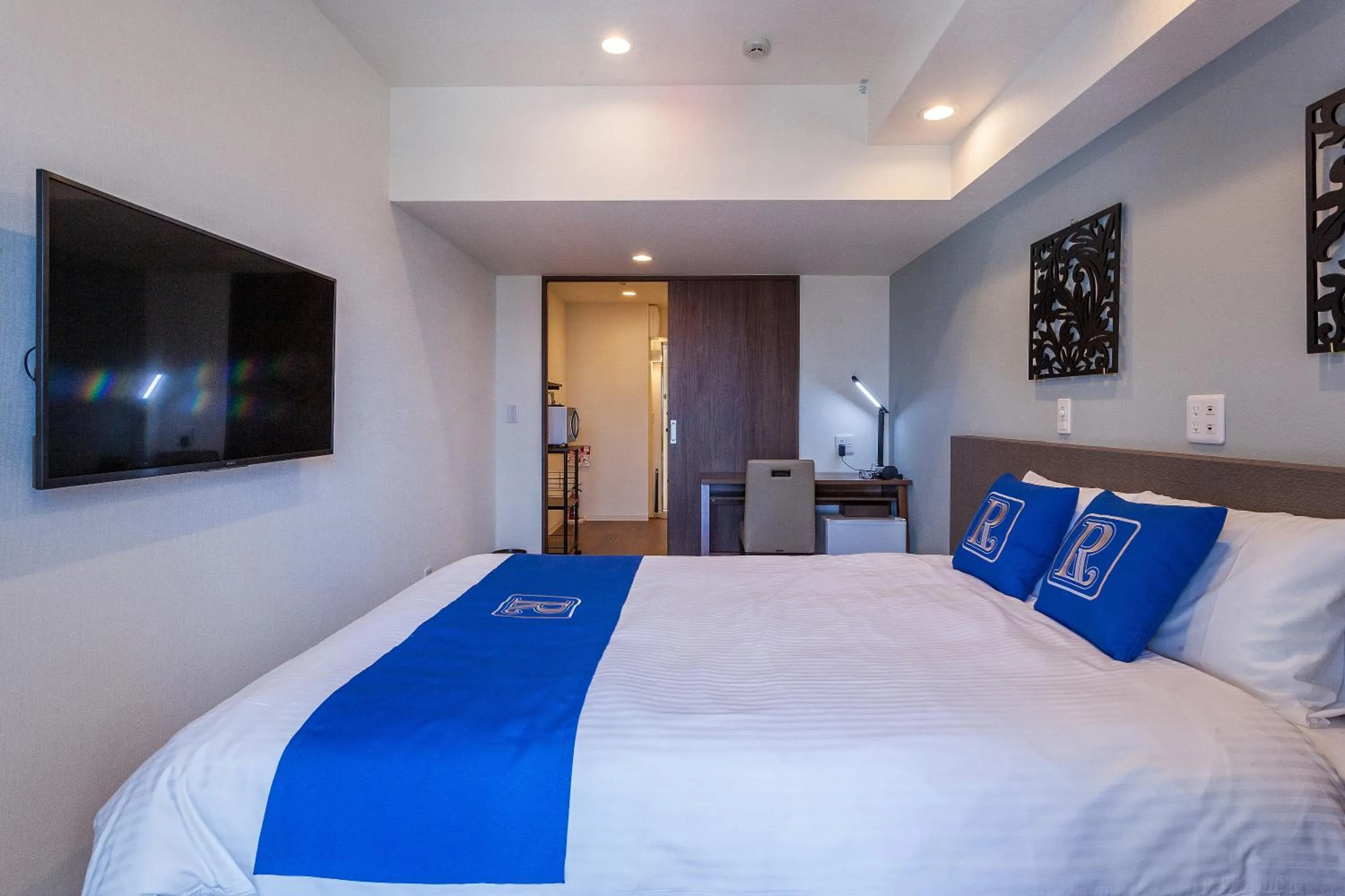 Bed in Living Inn Asahibashiekimae Premier