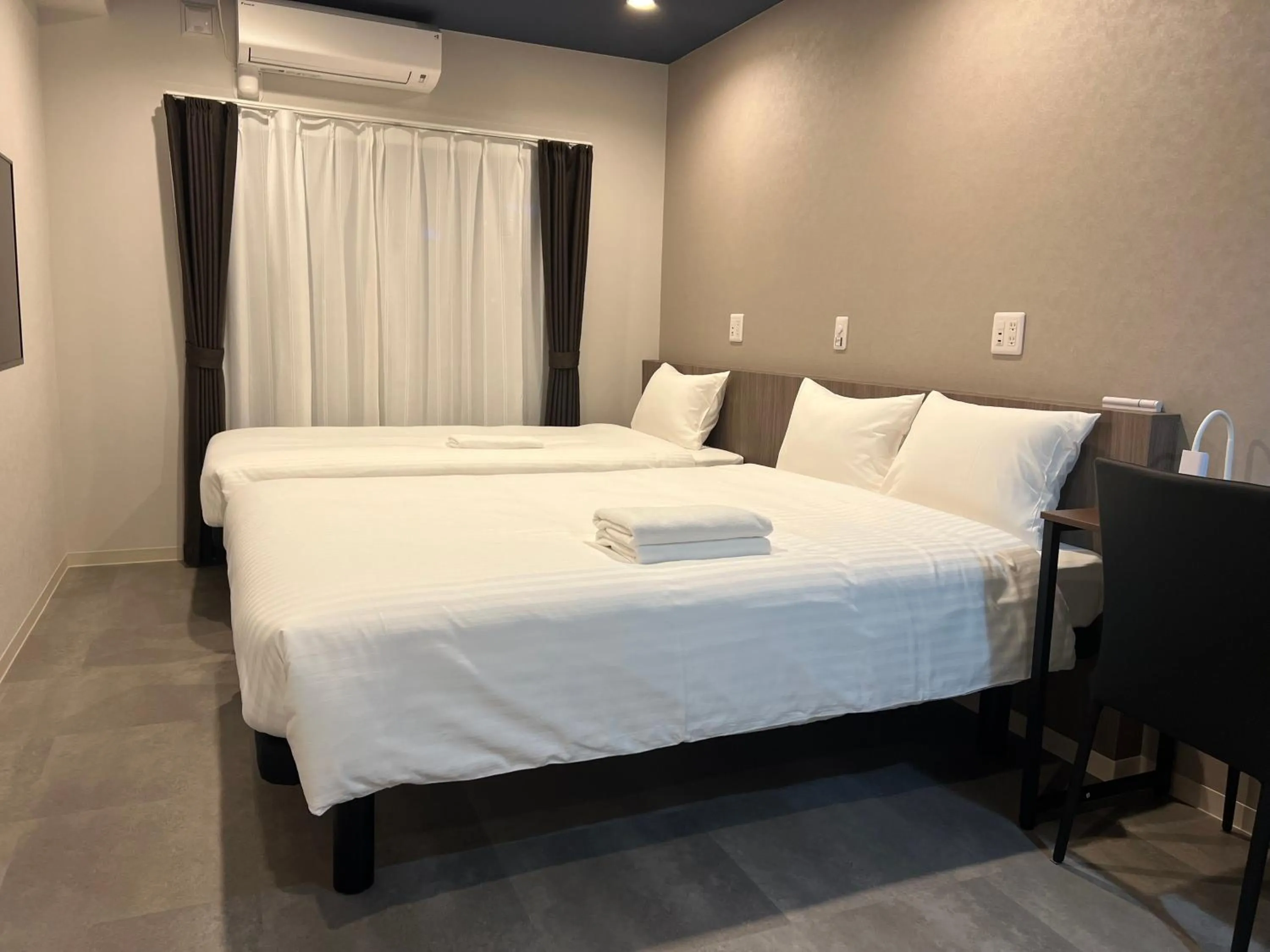 Bed in Living Inn Asahibashiekimae Premier