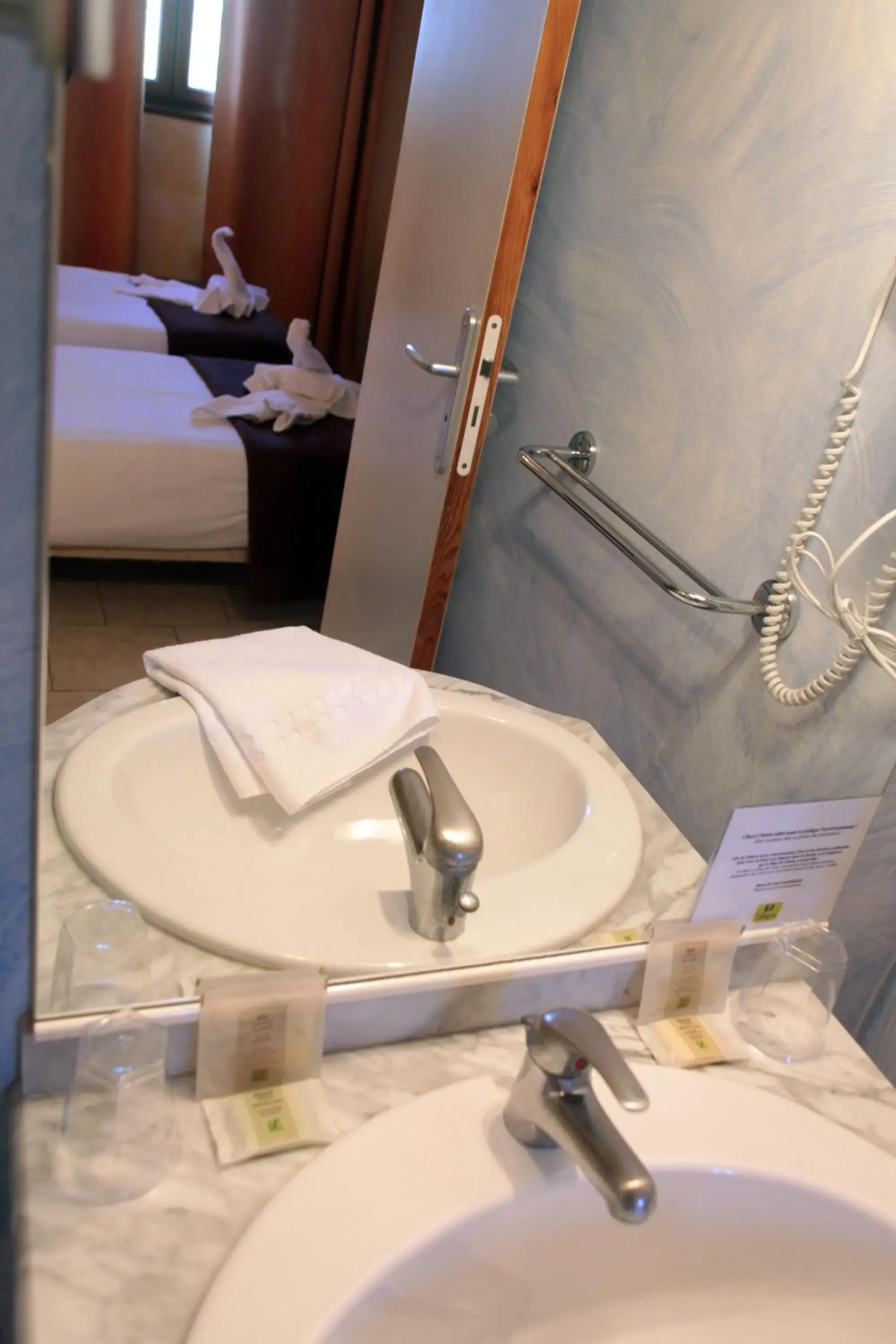 Bed in Logis Hôtel LE PRESSOIR Bed in Logis Hôtel LE PRESSOIR