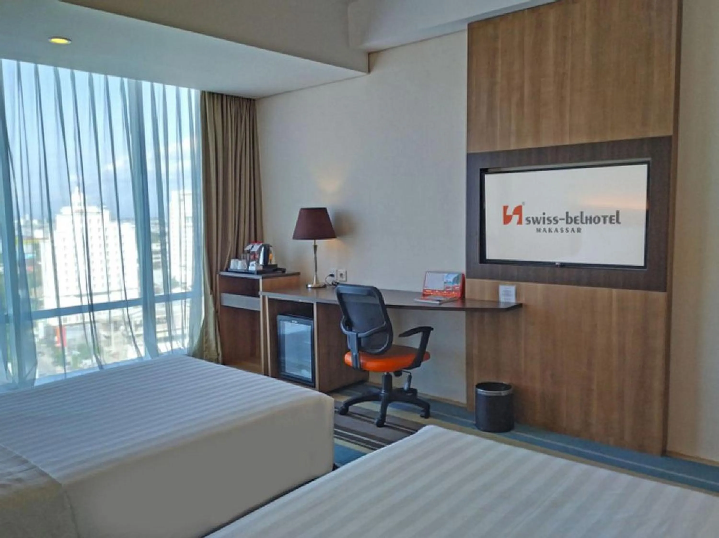 Bed in Swiss-Belhotel Makassar