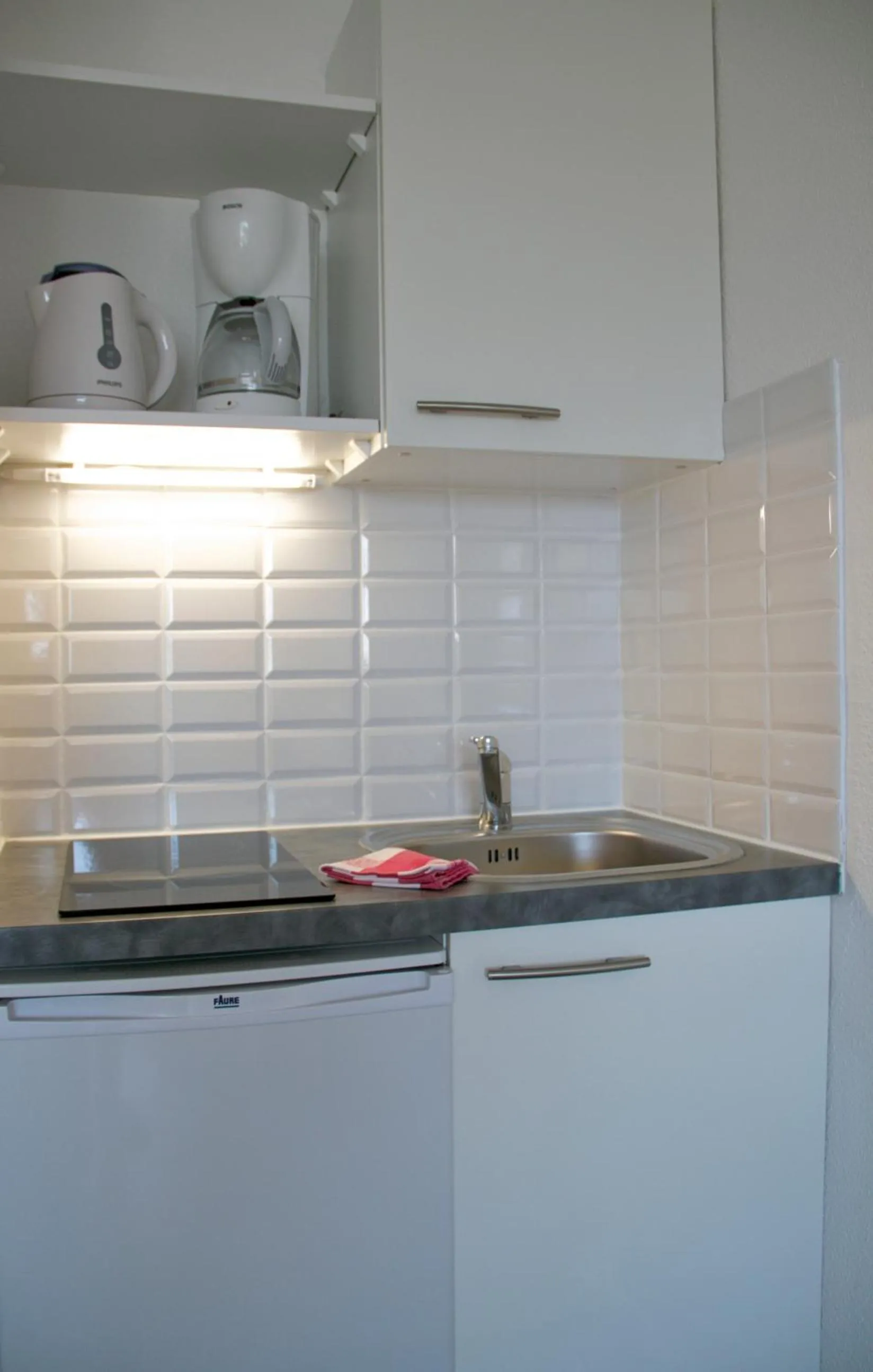 Kitchen or kitchenette in Louison Appart & Suite