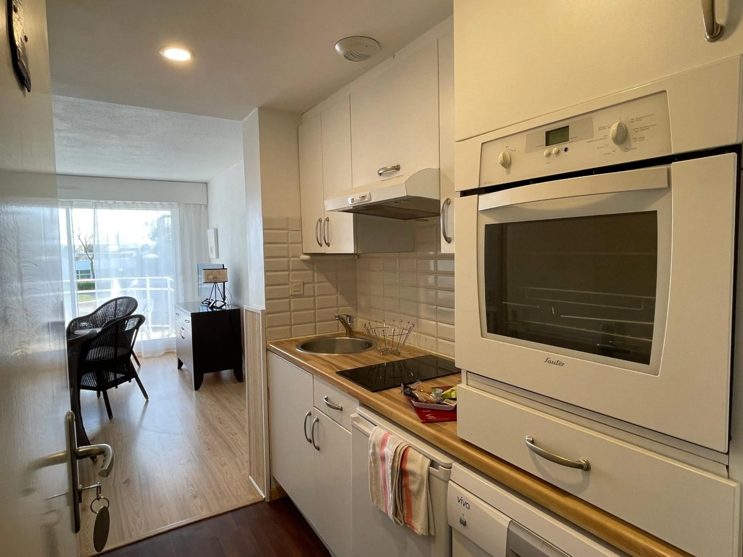 Kitchen or kitchenette in Louison Appart & Suite