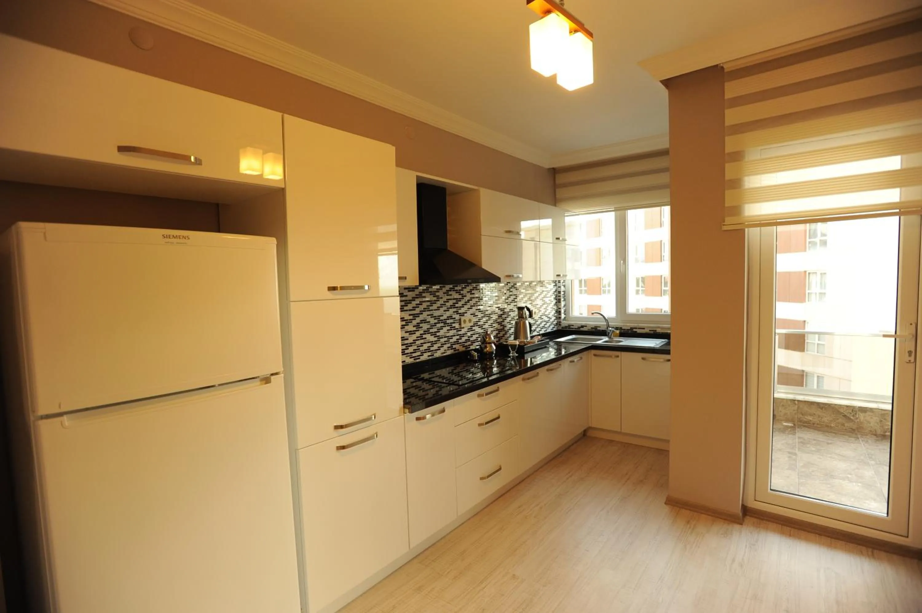 Kitchen or kitchenette in Qamar Prestige Suites