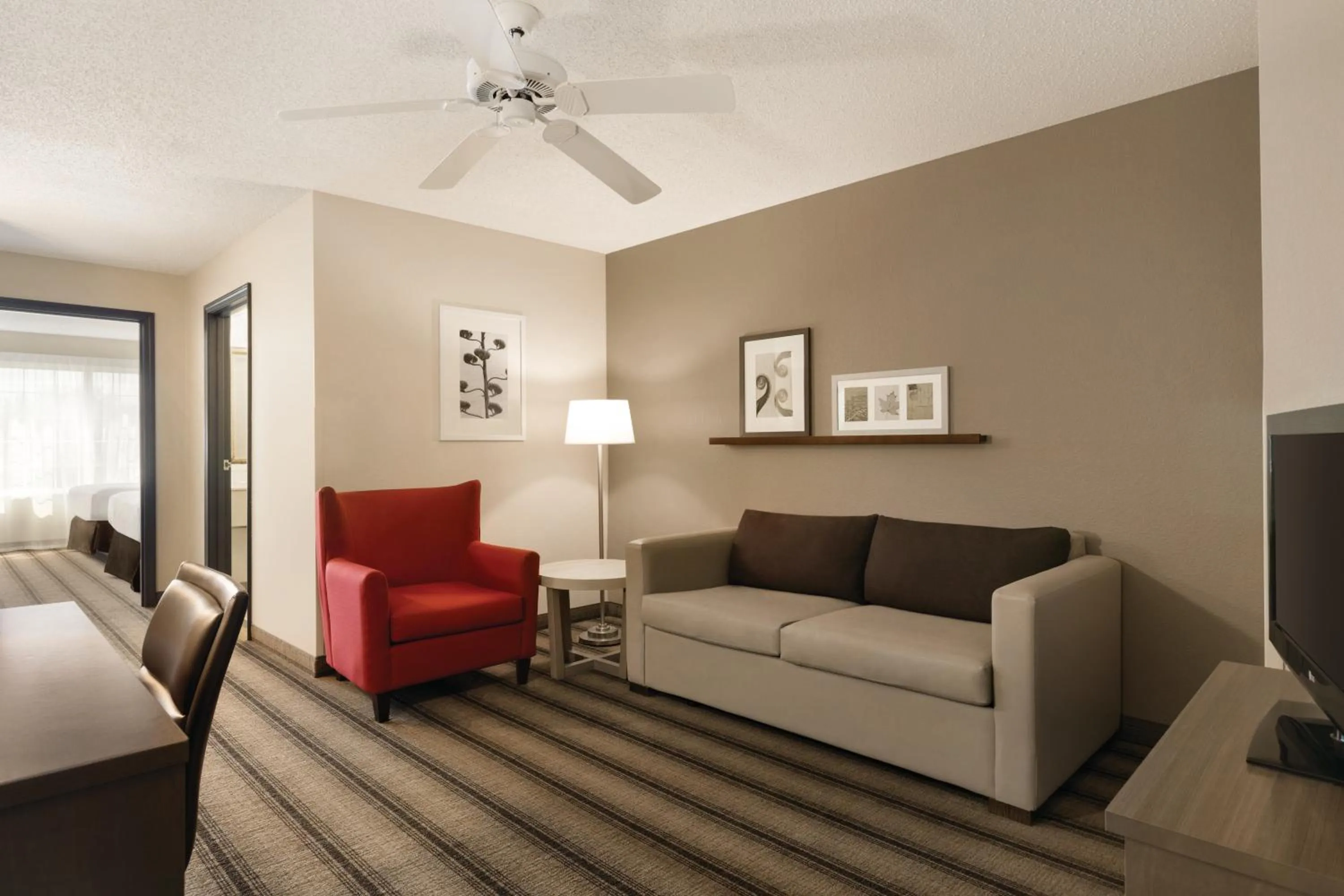 Seating area, Bed in Country Inn & Suites by Radisson, Indianapolis Airport South, IN
