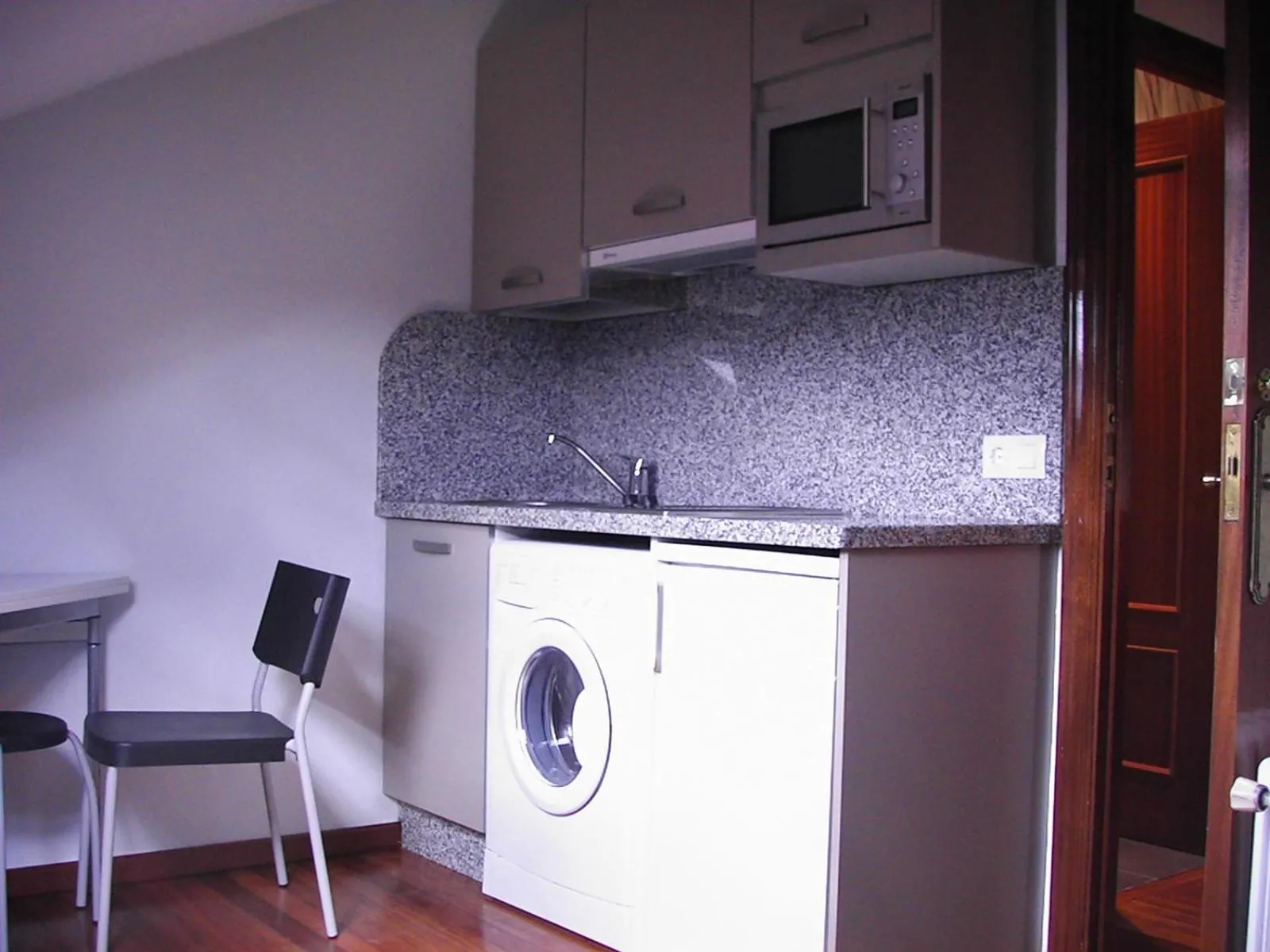 Kitchen or kitchenette in Apartamentos Cotiello