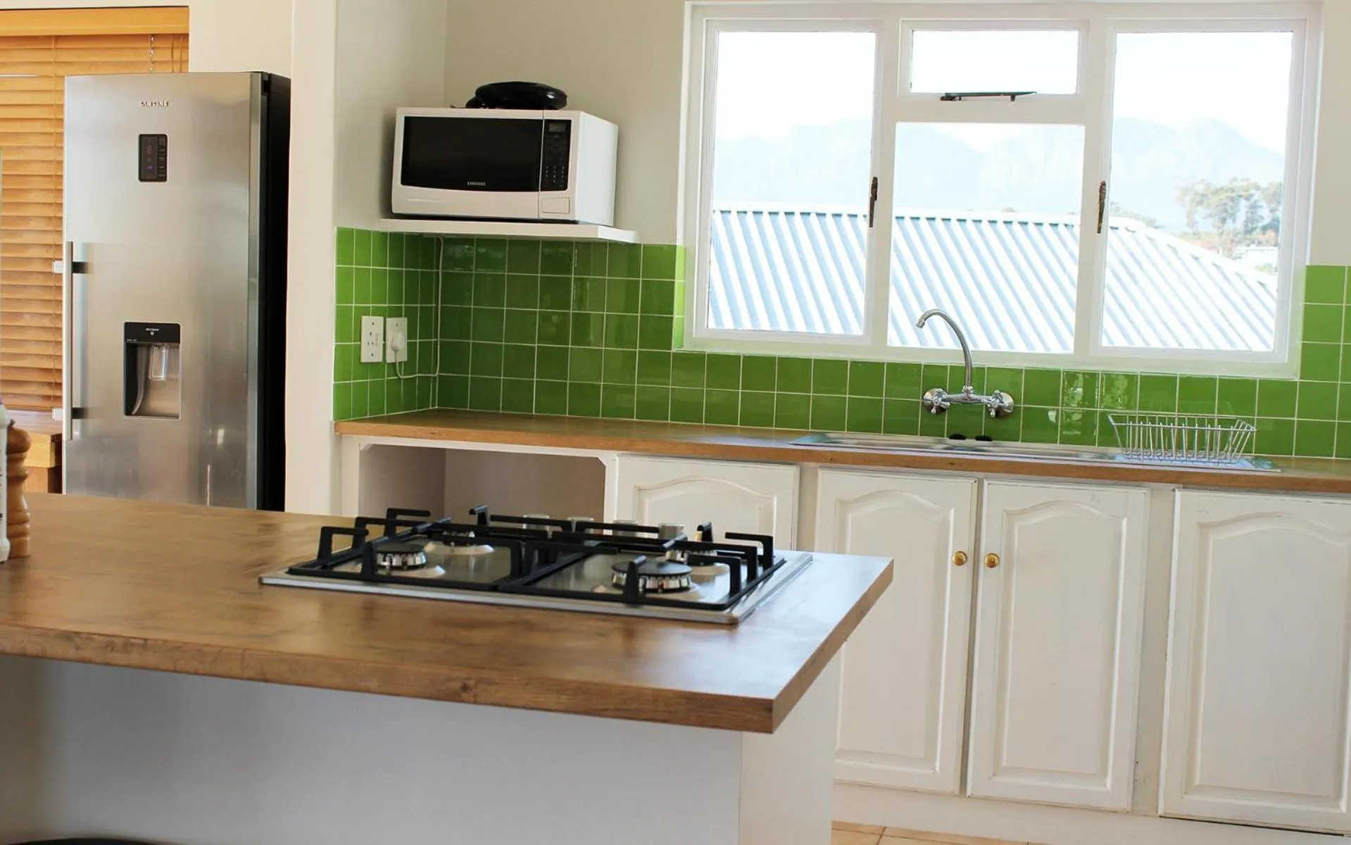 Kitchen or kitchenette in 'Die Braaihuis'- sleeps 6, Large Veranda, Sea Views, Central and Fabulous!
