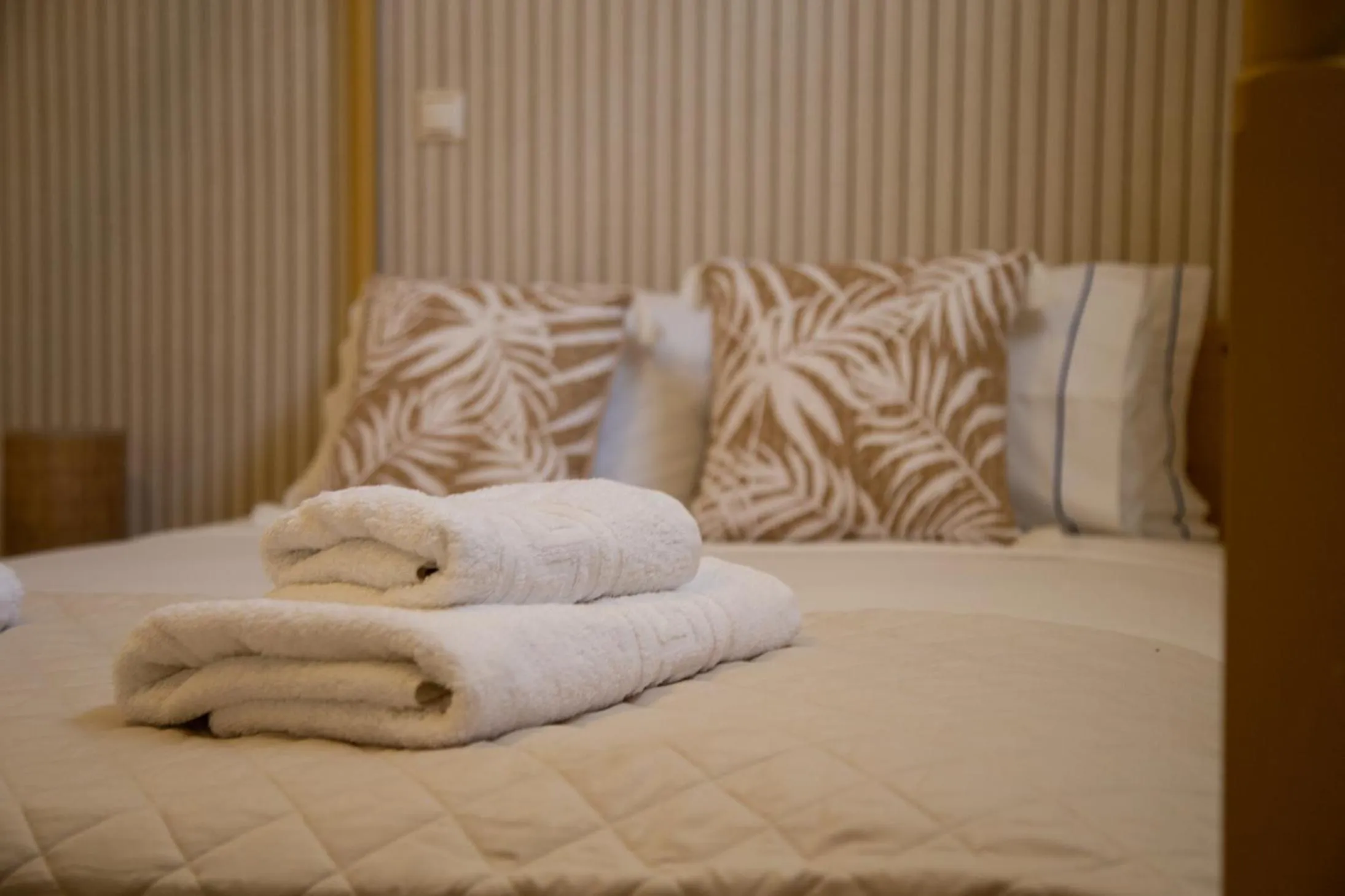 Bed in Poseidon Apartments and Villas by the Sea