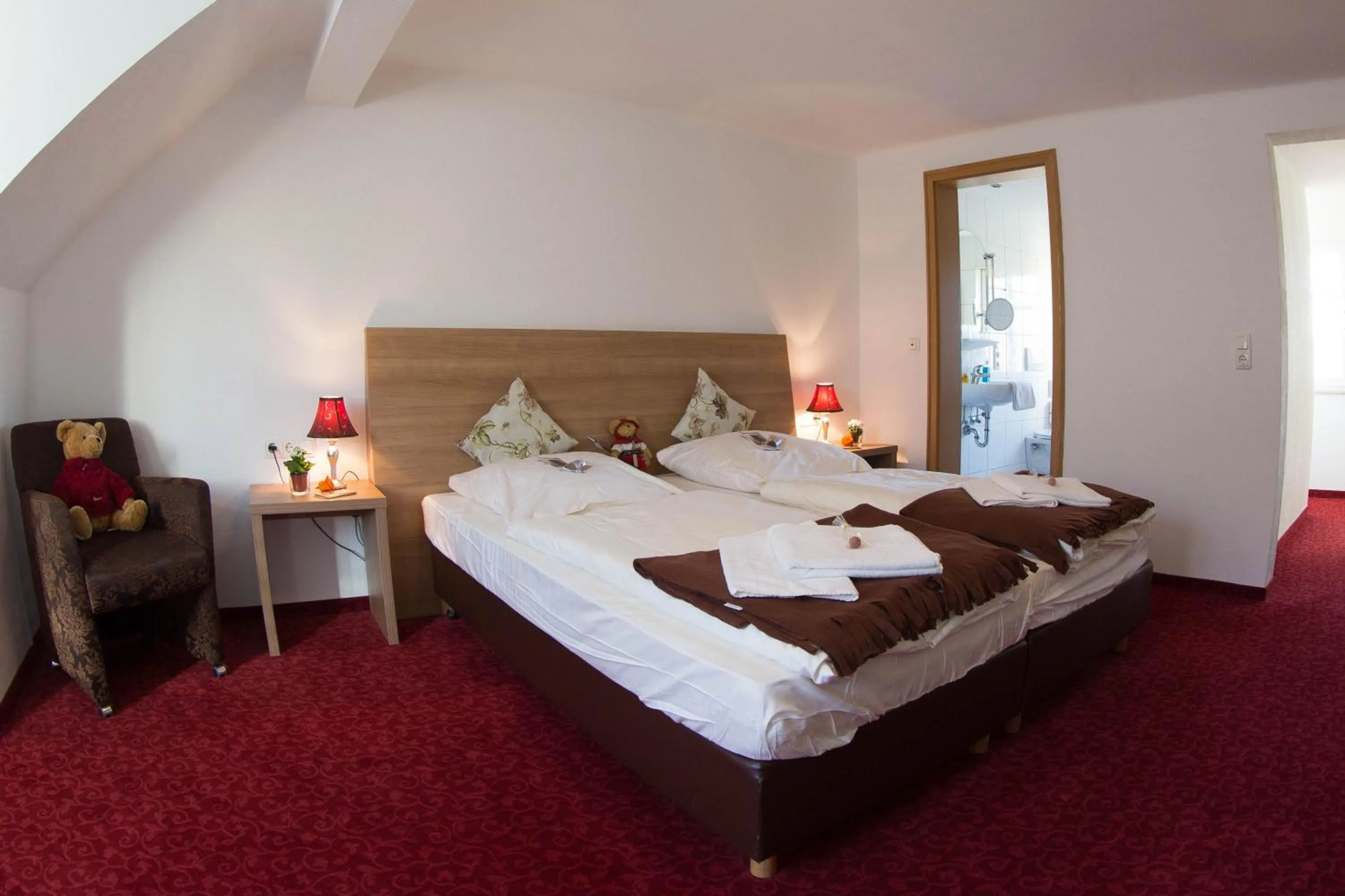 Bed in Boutiquehotel Goldene Rose - self-check-in