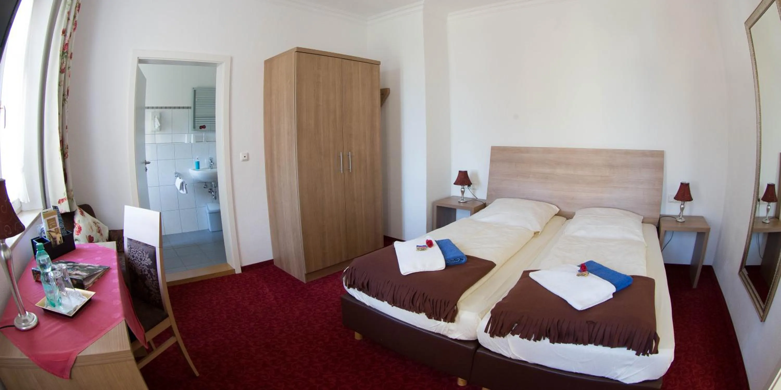 Bed in Boutiquehotel Goldene Rose - self-check-in