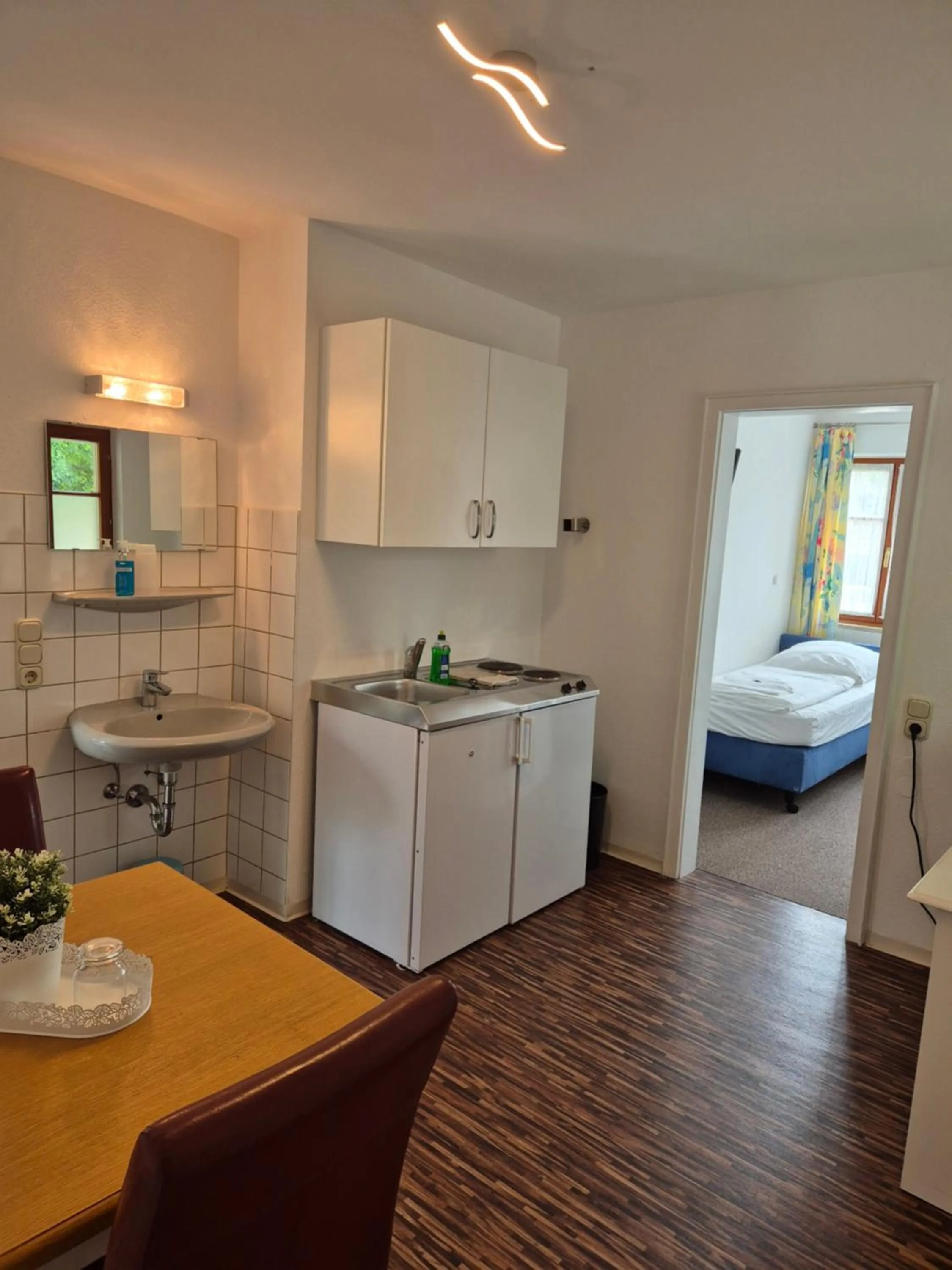 Kitchen or kitchenette, Bed in Boutiquehotel Goldene Rose - self-check-in