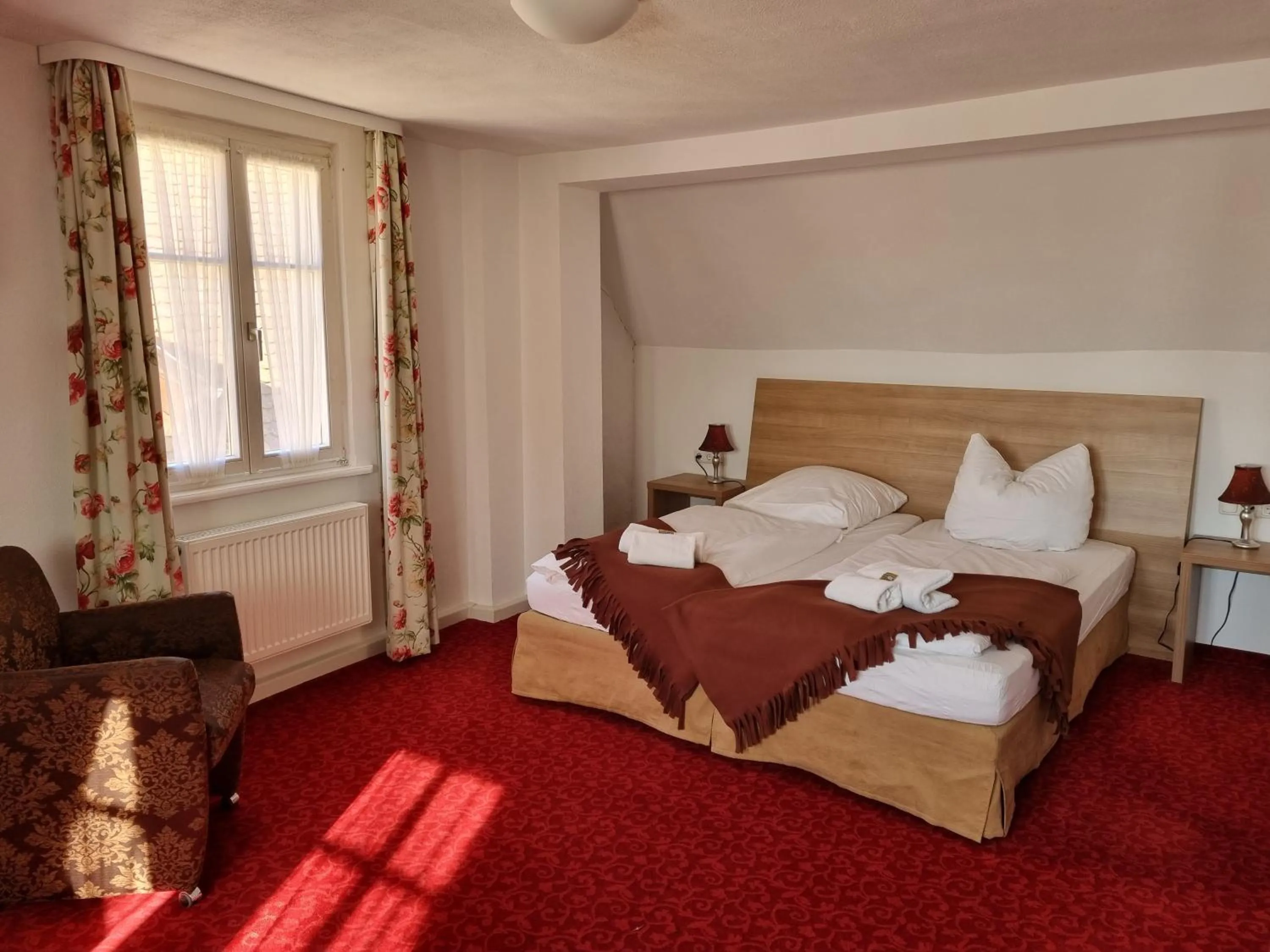 Bed in Boutiquehotel Goldene Rose - self-check-in