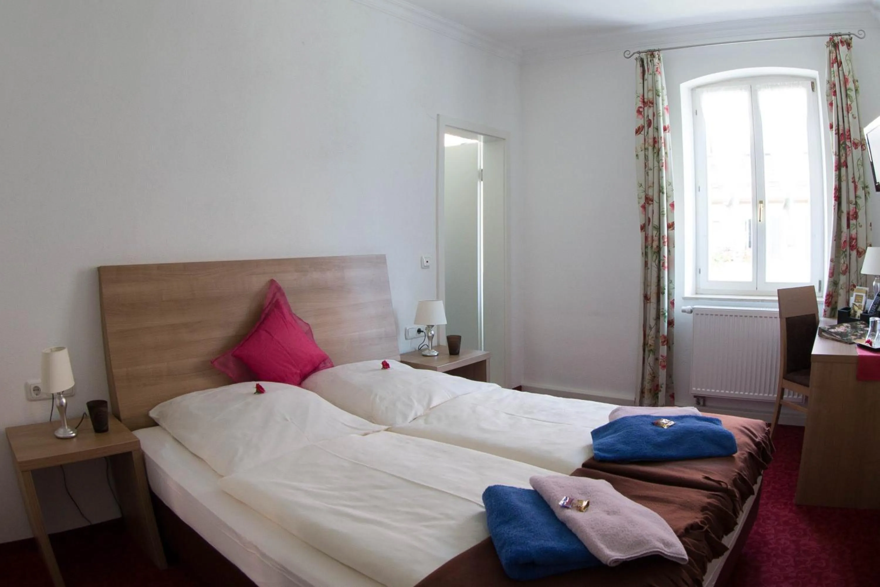 Bed in Boutiquehotel Goldene Rose - self-check-in