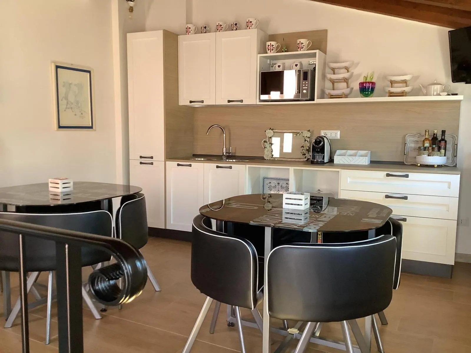 Communal lounge/ TV room in Affittacamere BaLu