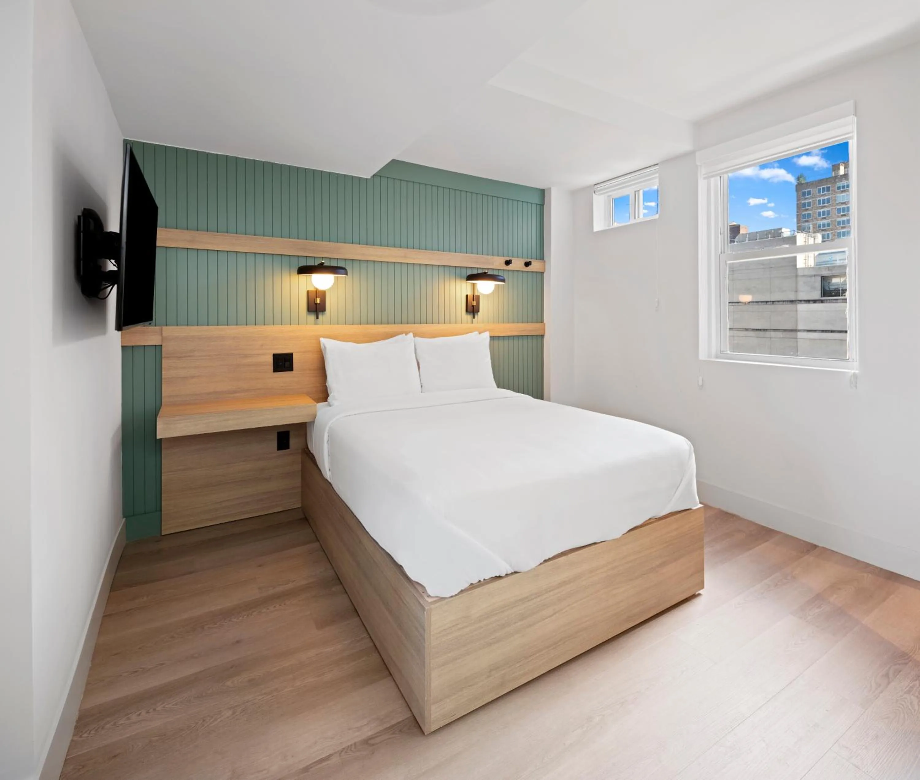 Bed in Riverside Tower Hotel