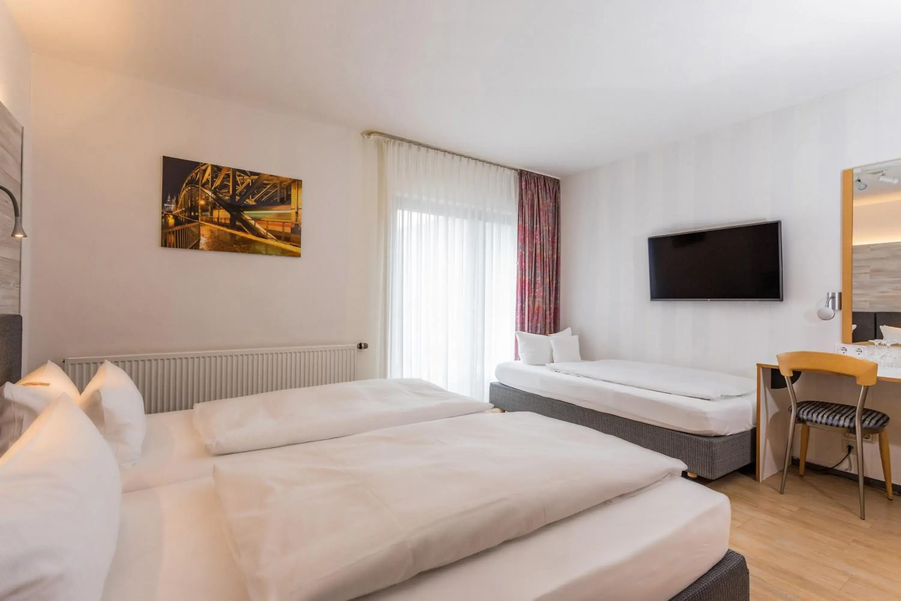 Triple Room with Balcony - single occupancy in Hotel & Wirtshaus Hansen Triple Room with Balcony - single occupancy in Hotel & Wirtshaus Hansen