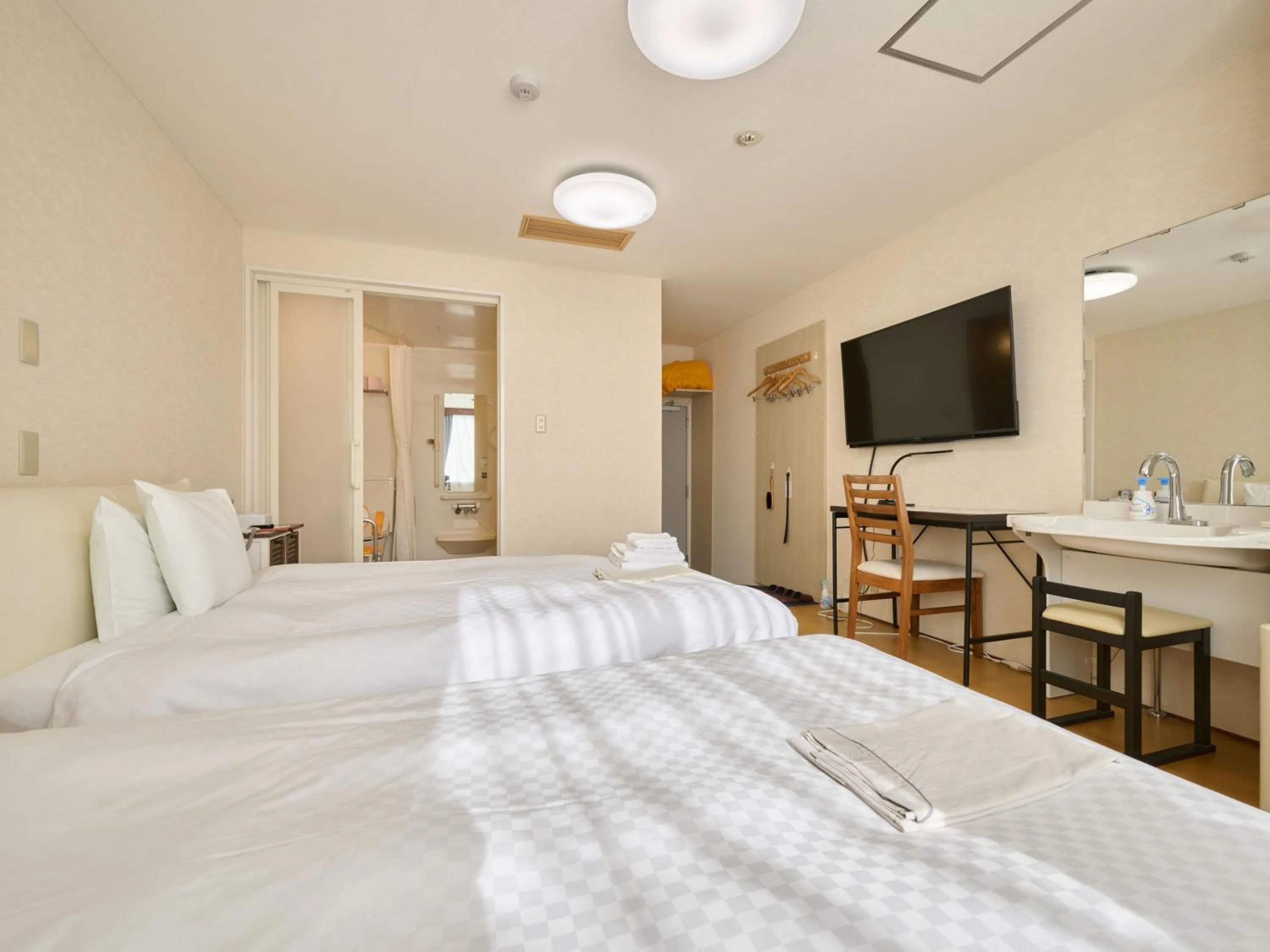 Photo of the whole room, Bed in Okasan Hotel