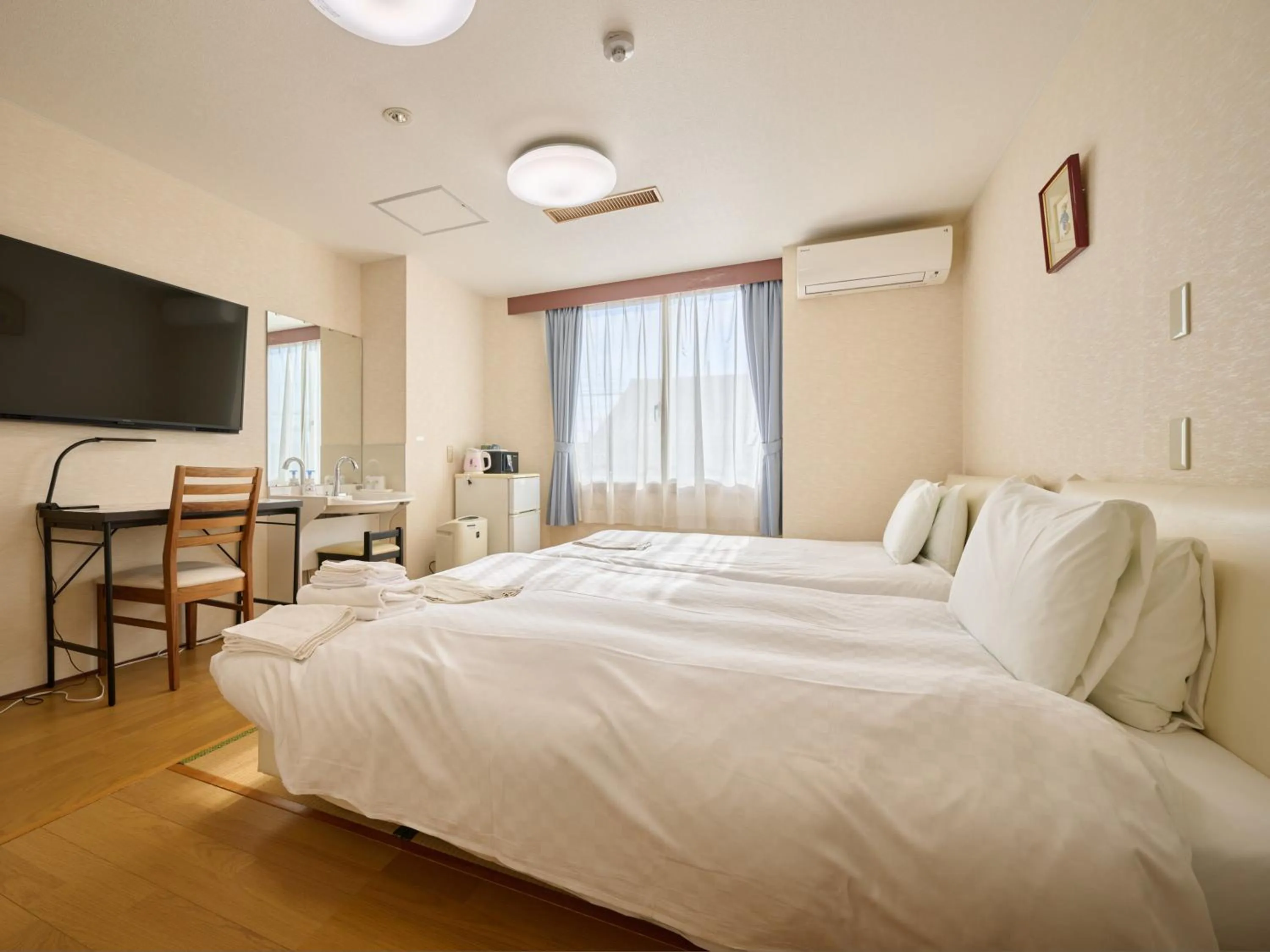 Photo of the whole room, Bed in Okasan Hotel