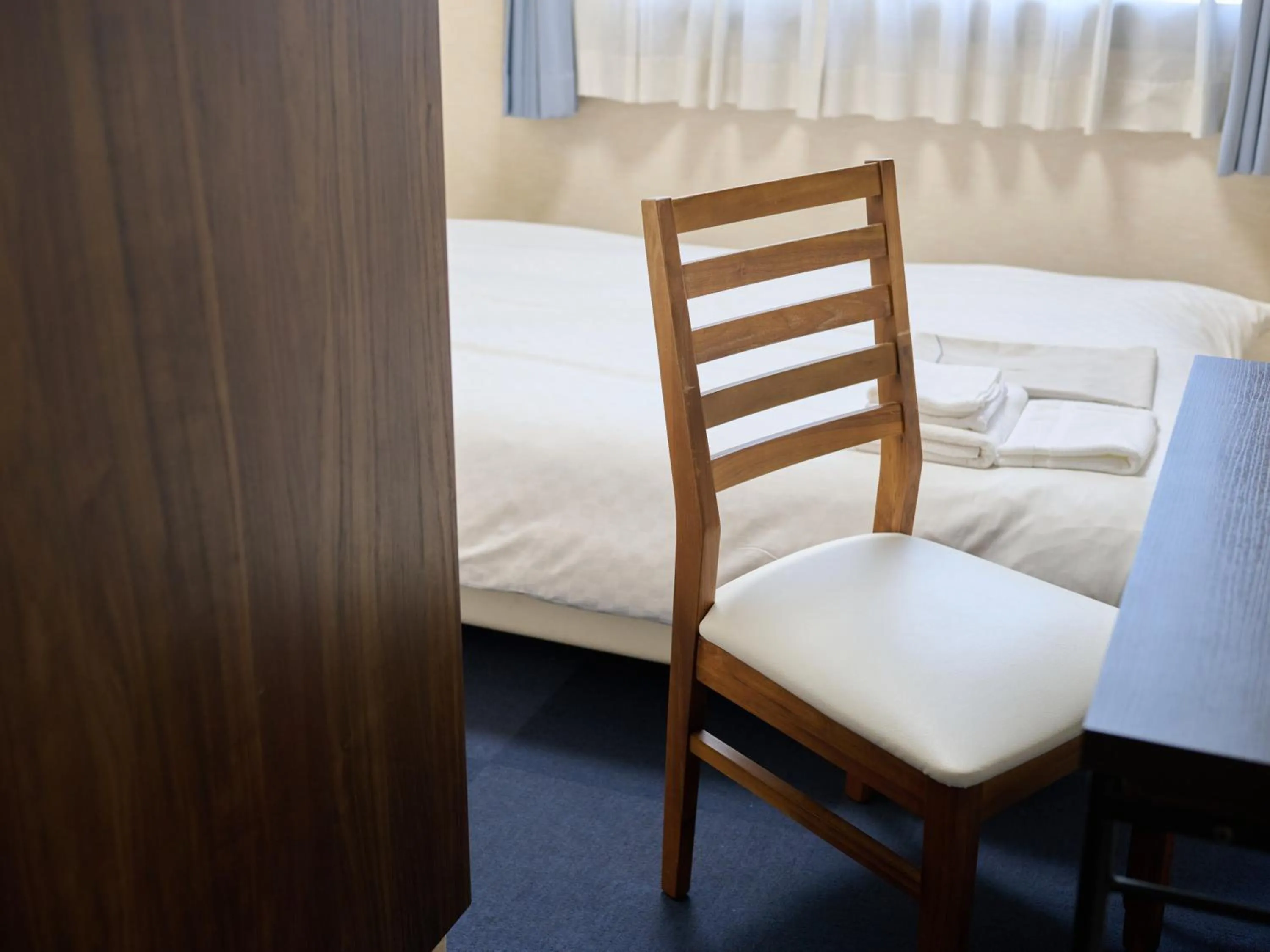 Photo of the whole room, Bed in Okasan Hotel