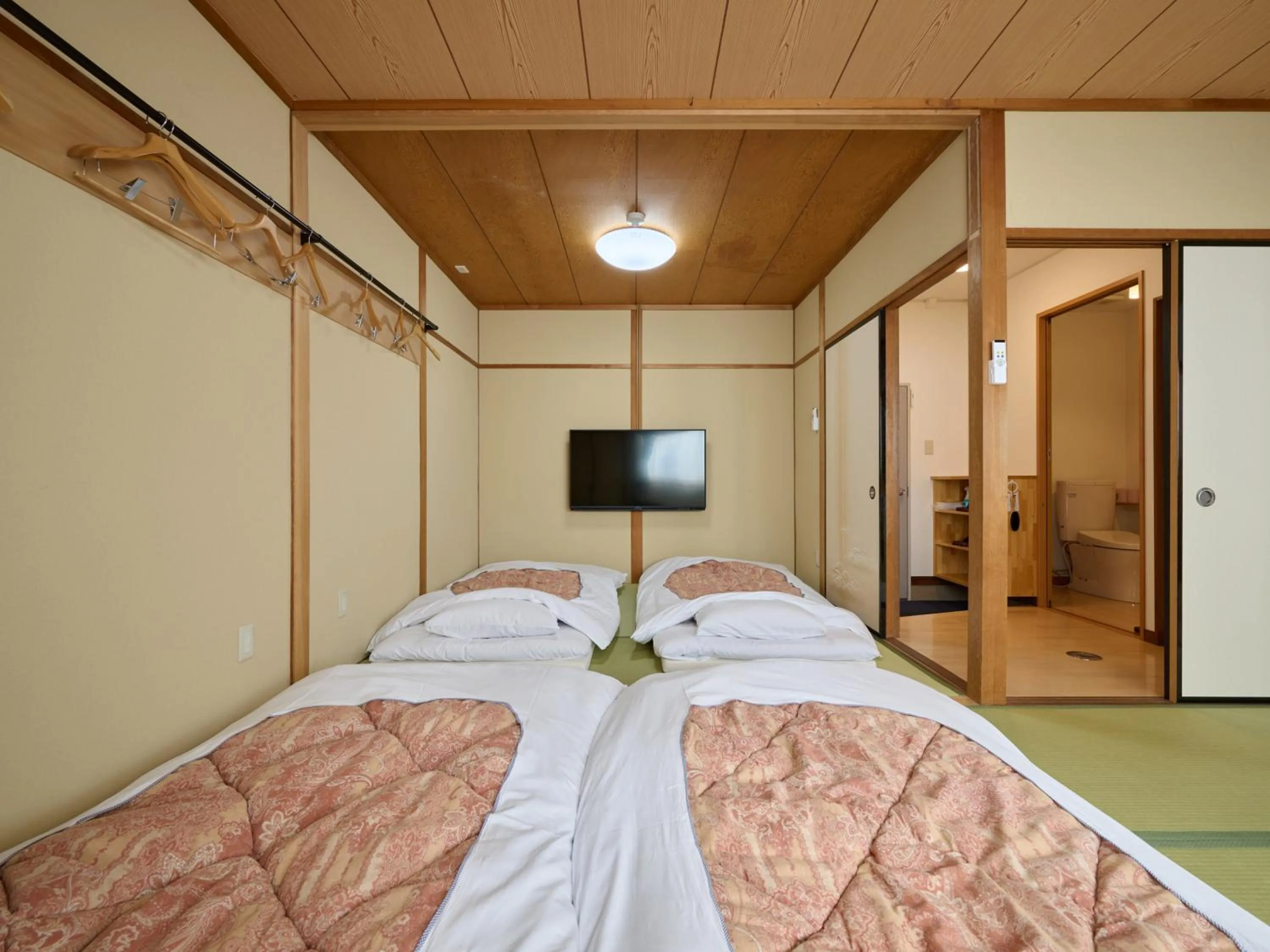 Photo of the whole room, Bed in Okasan Hotel