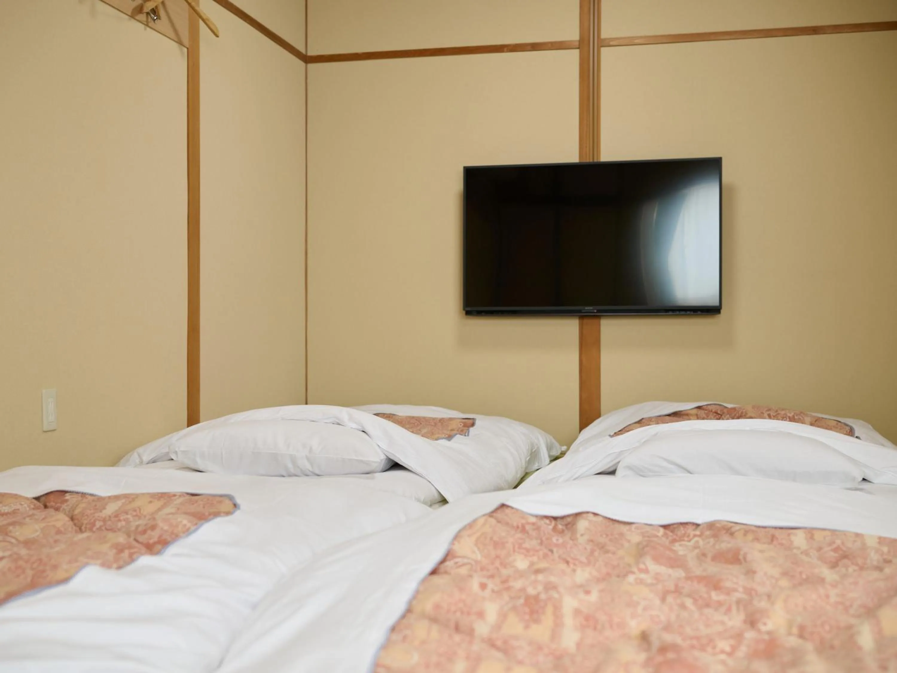 Photo of the whole room, Bed in Okasan Hotel